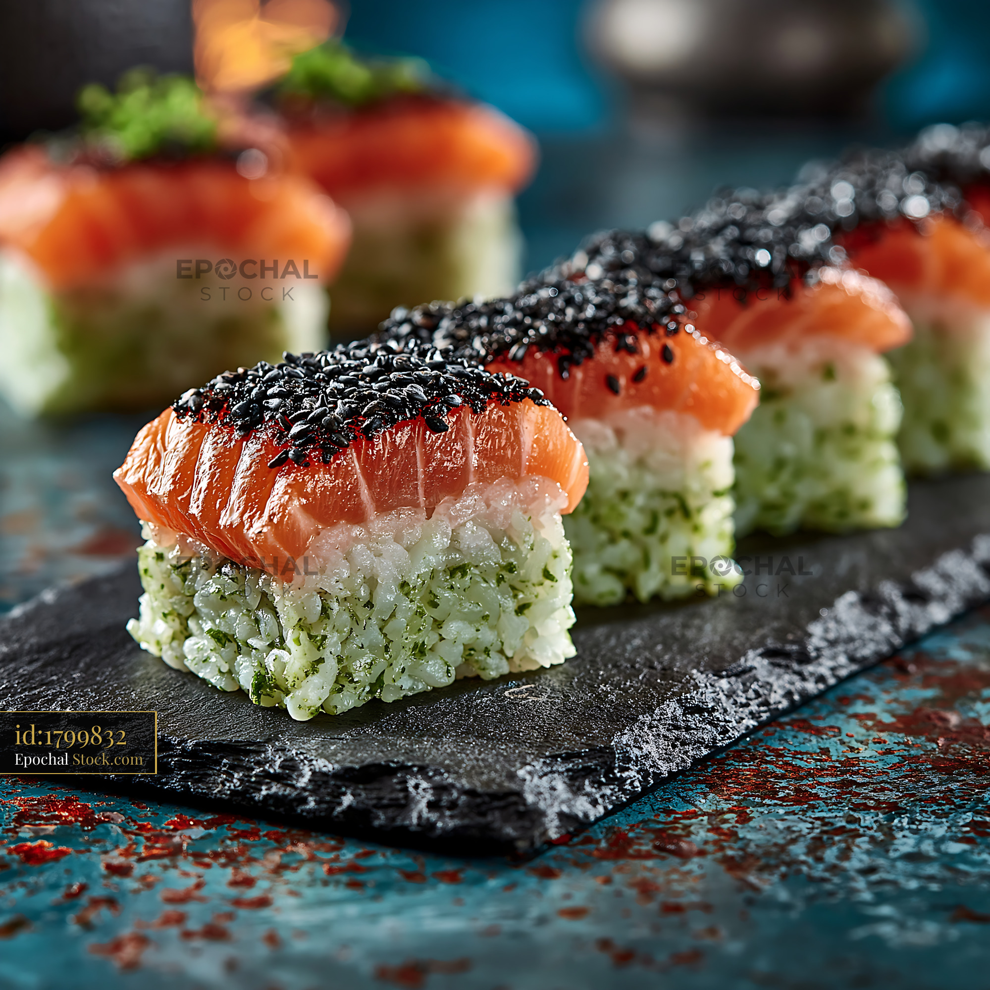 Gourmet sushi with spirulina rice topped with salmon and sesame - stock photo