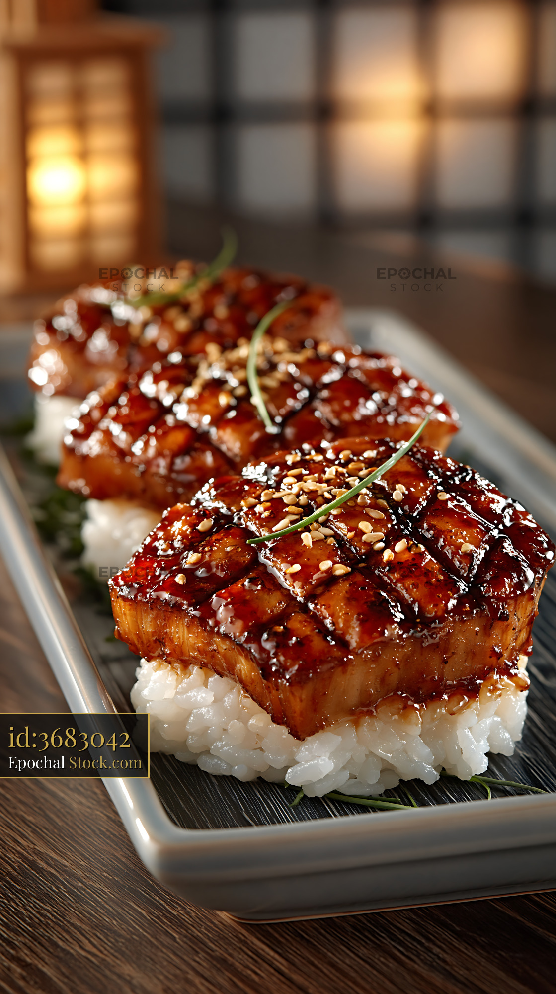 Seared truffle yellowtail sushi nigiri with sesame seeds and chives - stock photo