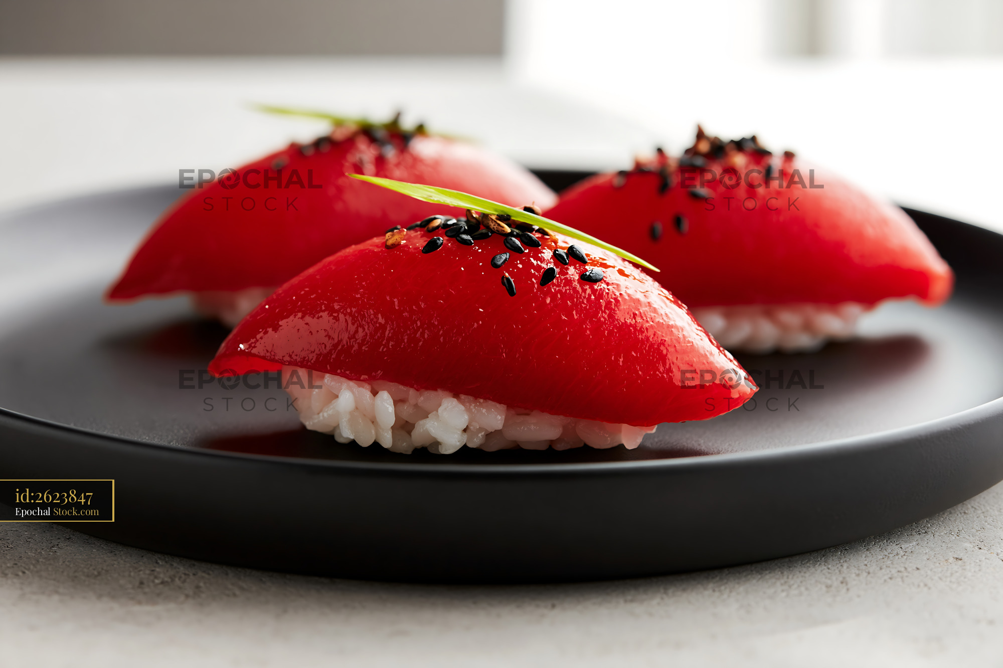 Plant-based watermelon tuna sushi nigiri on a black plate - stock photo