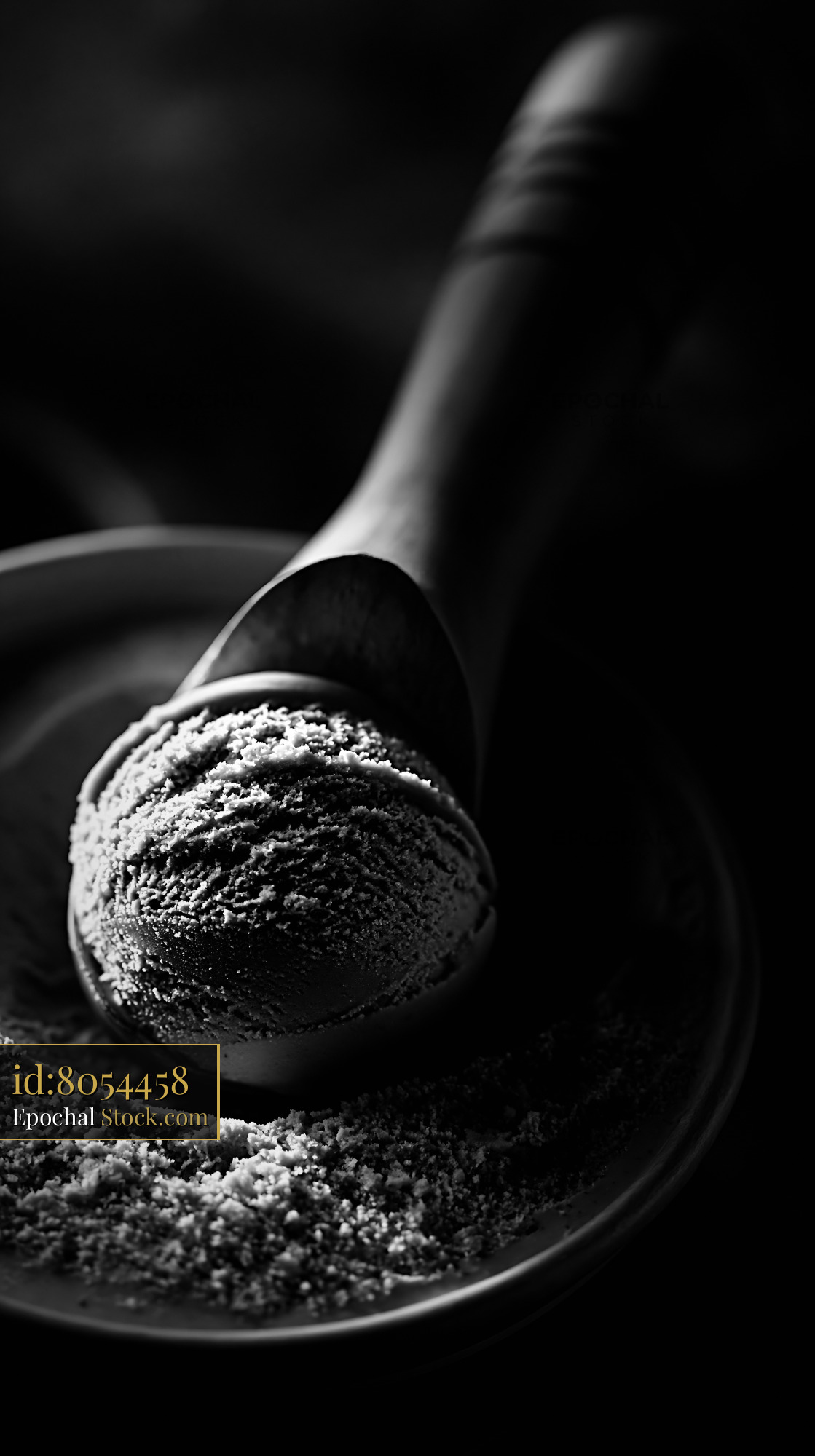 Artisanal fig leaf ice cream scoop in dramatic black and white - stock photo