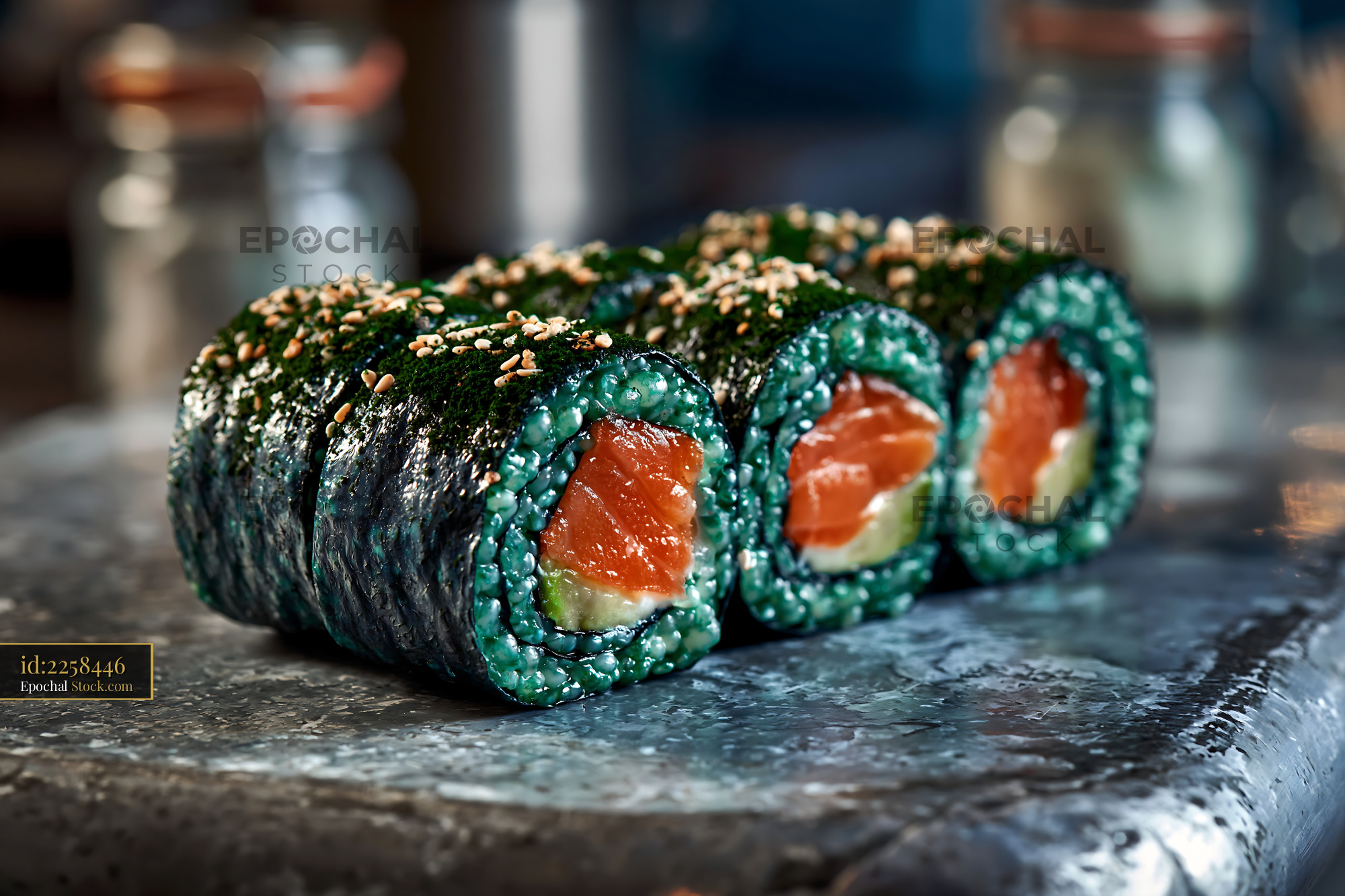 Fresh sushi rolls with spirulina powder rice salmon and avocado - stock photo