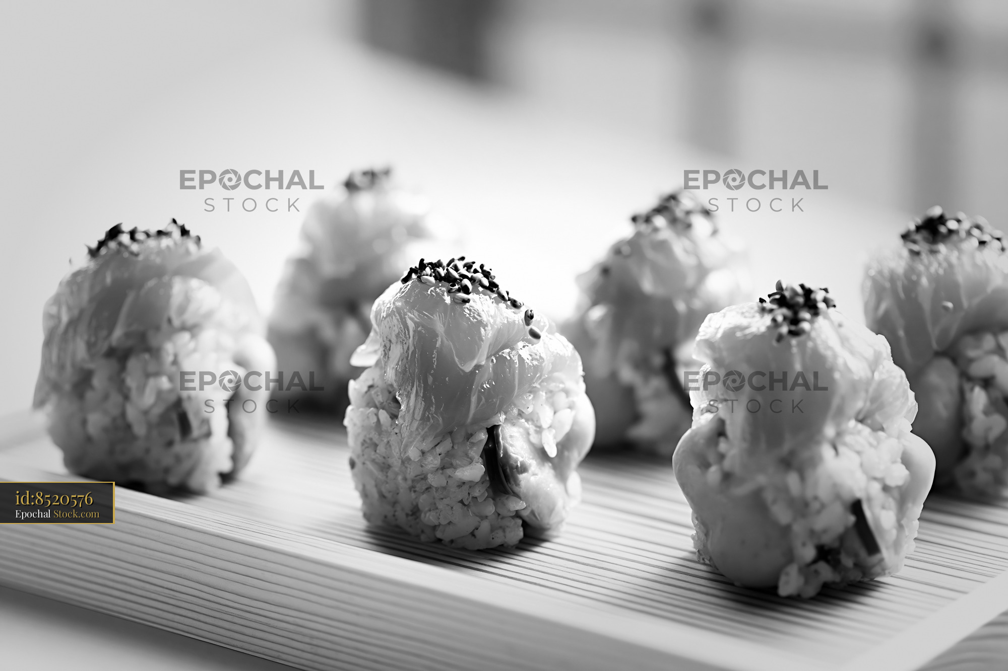 Black and white close-up of matcha infused rice sushi rolls - stock photo