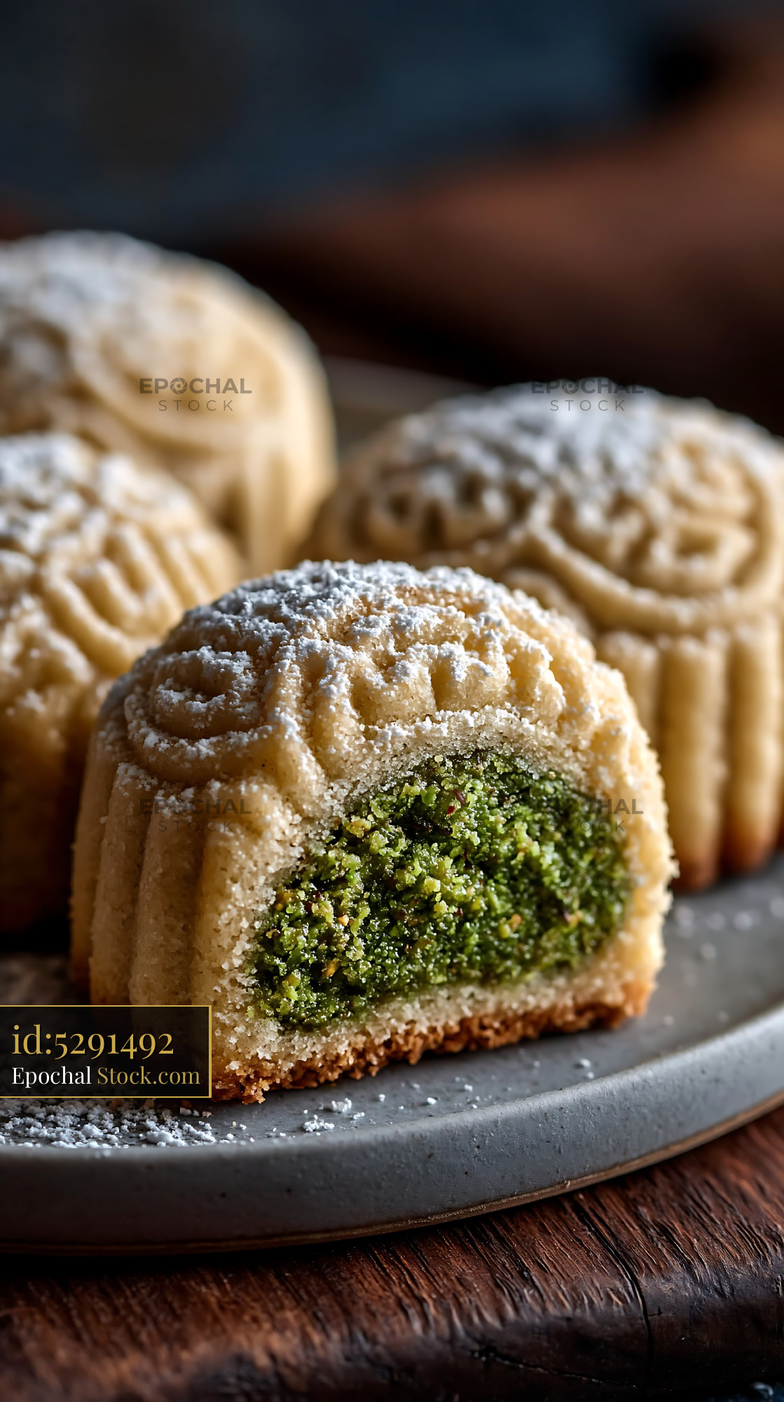 Traditional pistachio maamoul biscuits dusted with icing sugar - stock photo