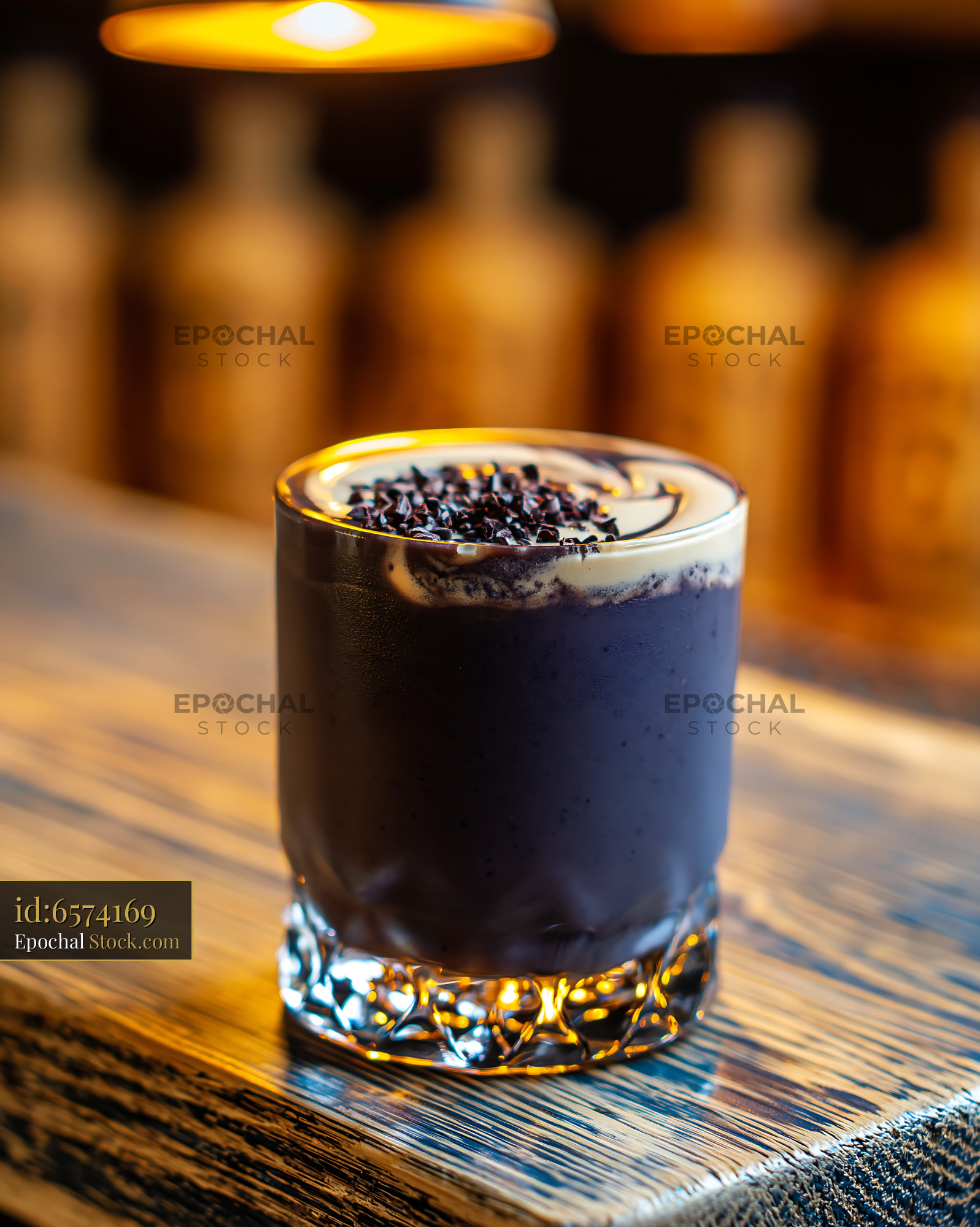 Creamy black bean smoothie topped with cocoa nibs on a wooden bar - stock photo