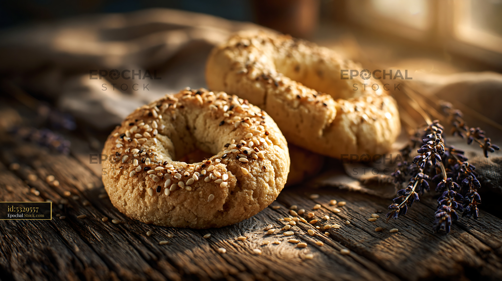 Freshly baked mahlab spice biscuits with sesame seeds on rustic wood - stock photo