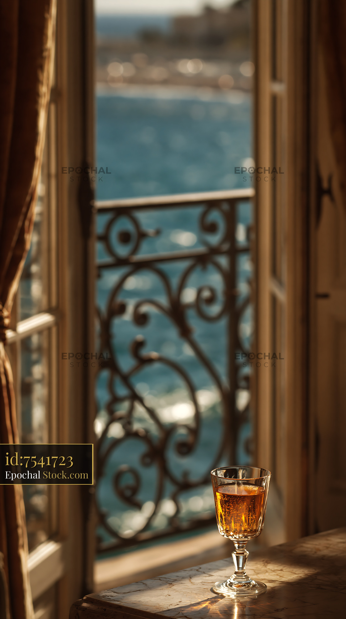 Glass of wine on marble table with luxury hotel balcony view - stock photo