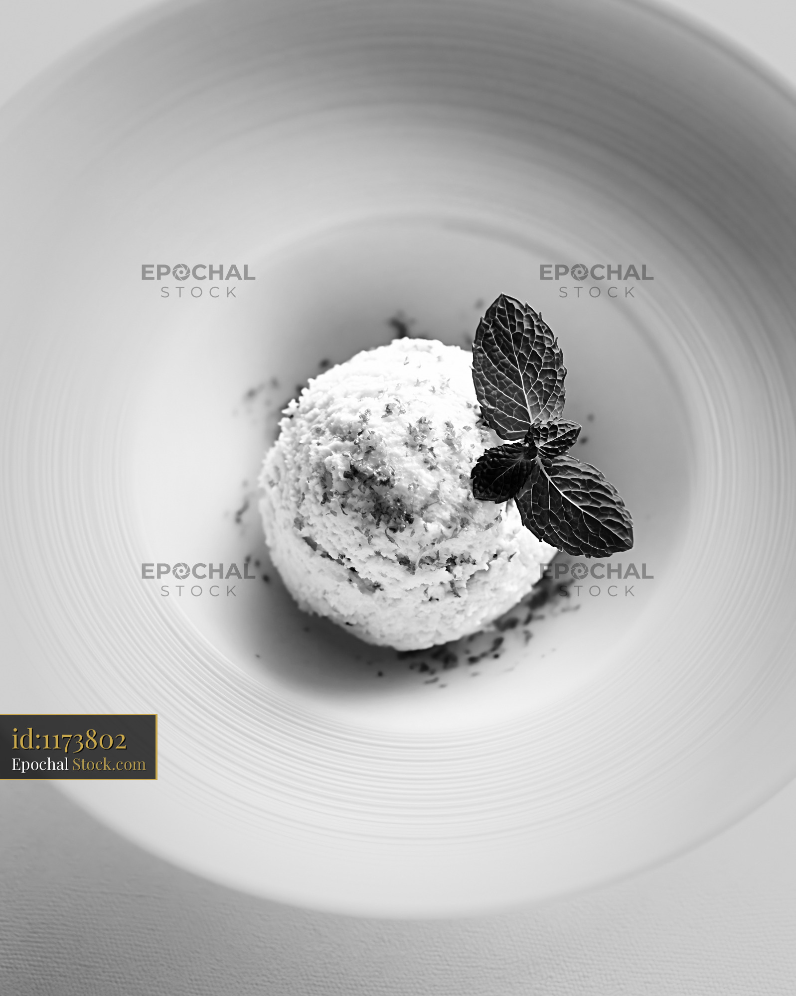 Overhead view of chartreuse ice cream with mint in a minimalist bowl - stock photo