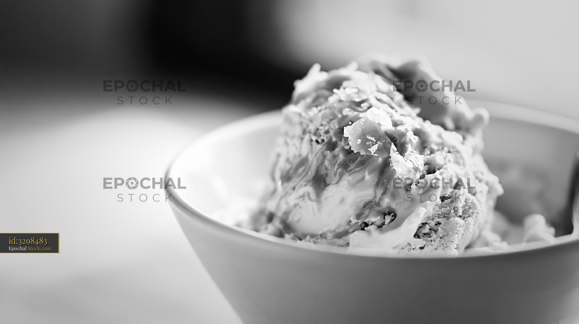 Artisanal fleur de sel caramel ice cream in a white ceramic bowl - stock photo