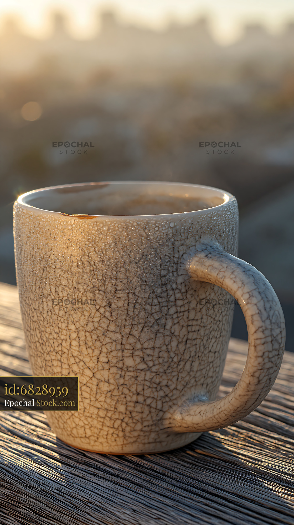 Ceramic coffee cup on wooden balcony railing during city sunrise - stock photo