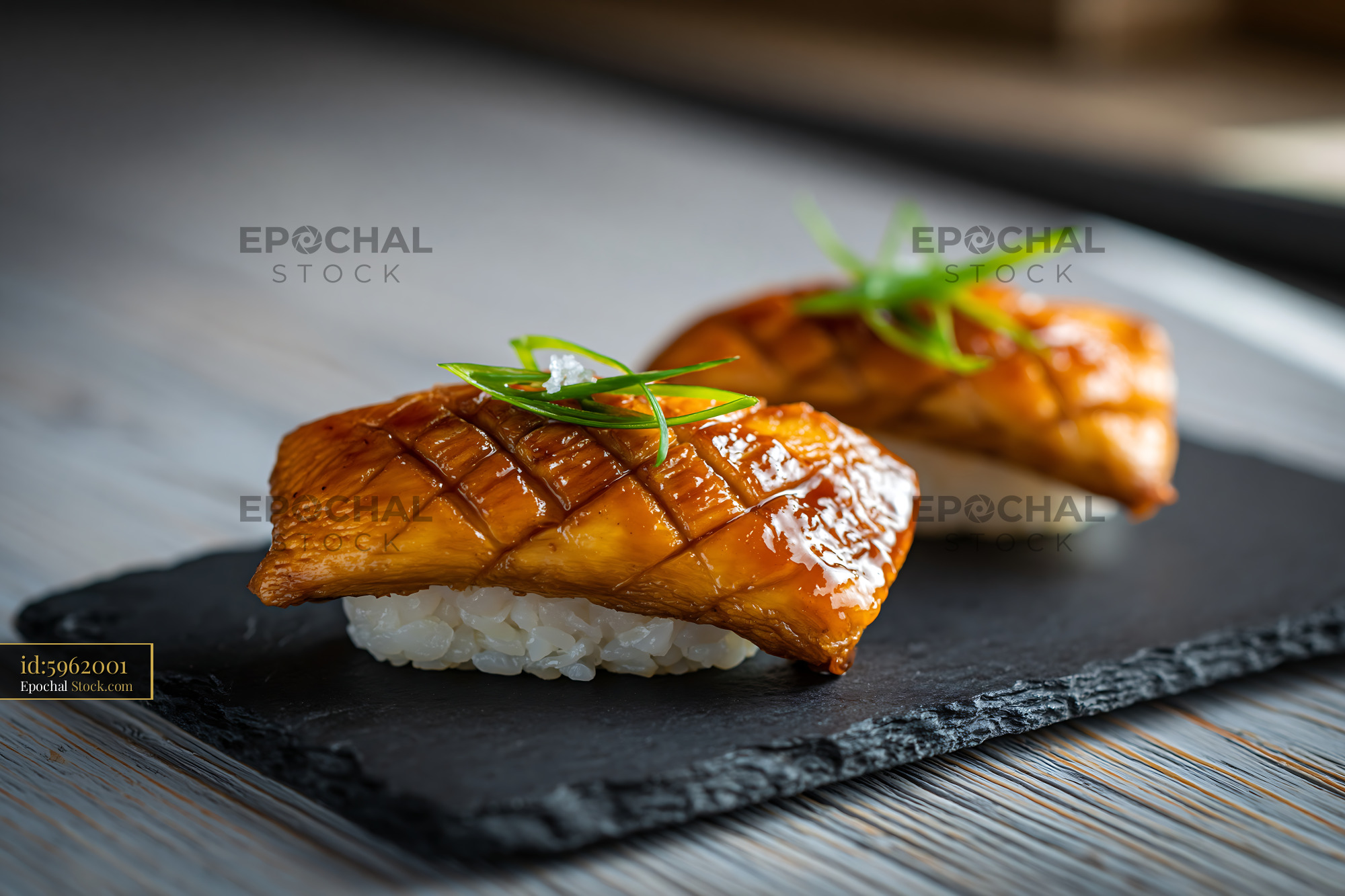 Vegan king oyster mushroom sushi nigiri on black slate plate - stock photo