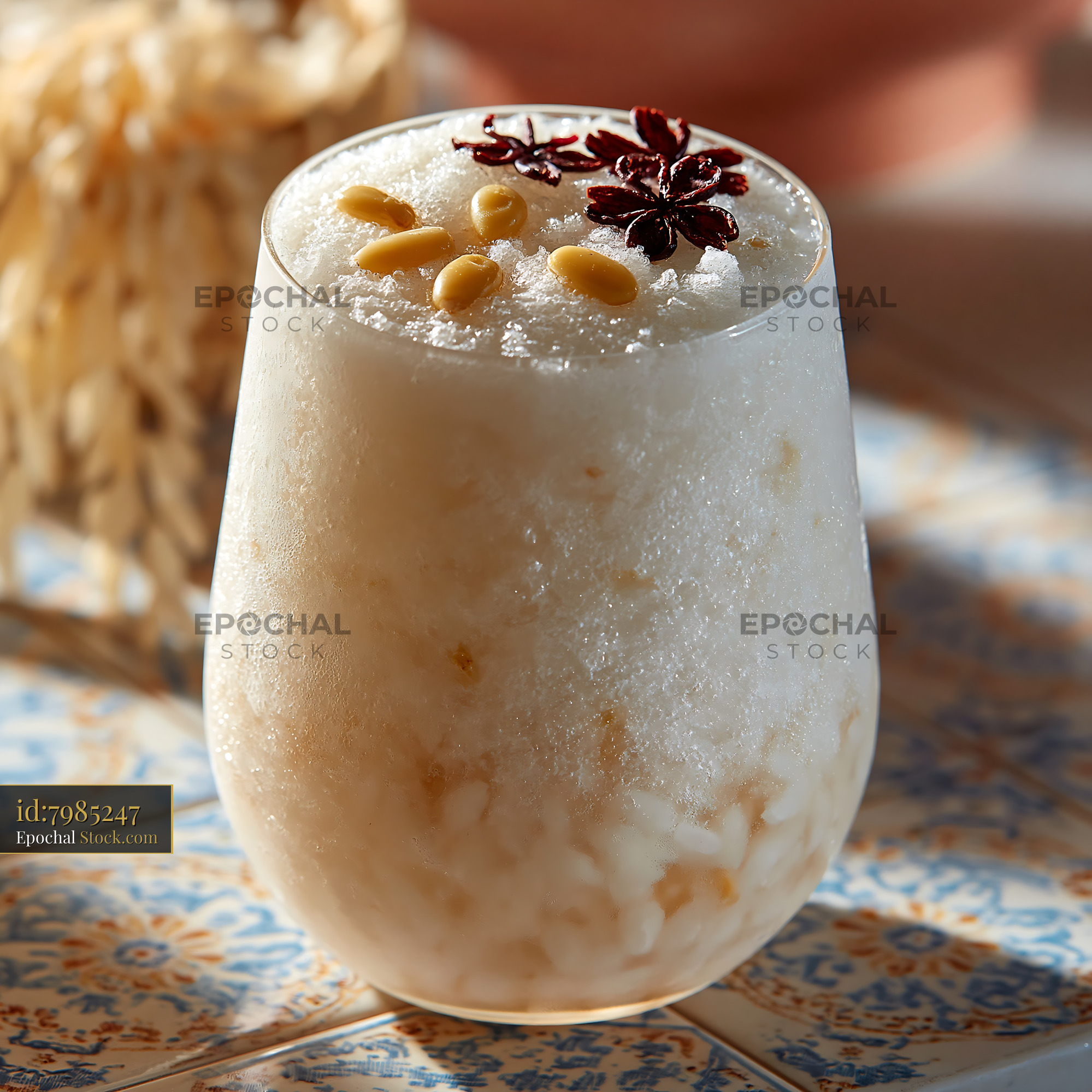 Refreshing sikhye rice smoothie topped with pine nuts and star anise - stock photo