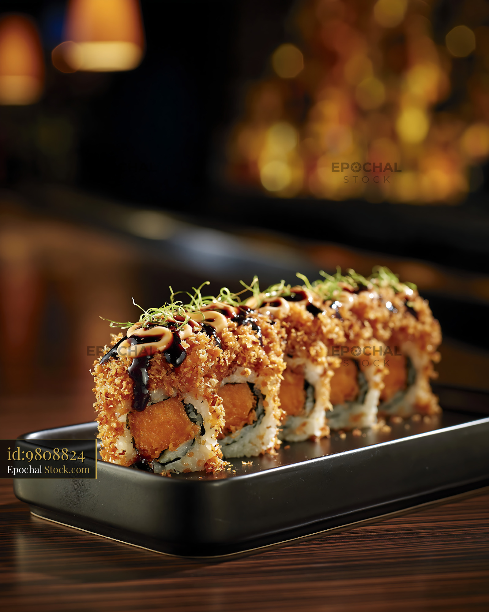 Crispy sweet potato crunch sushi rolls with sauce and microgreens - stock photo