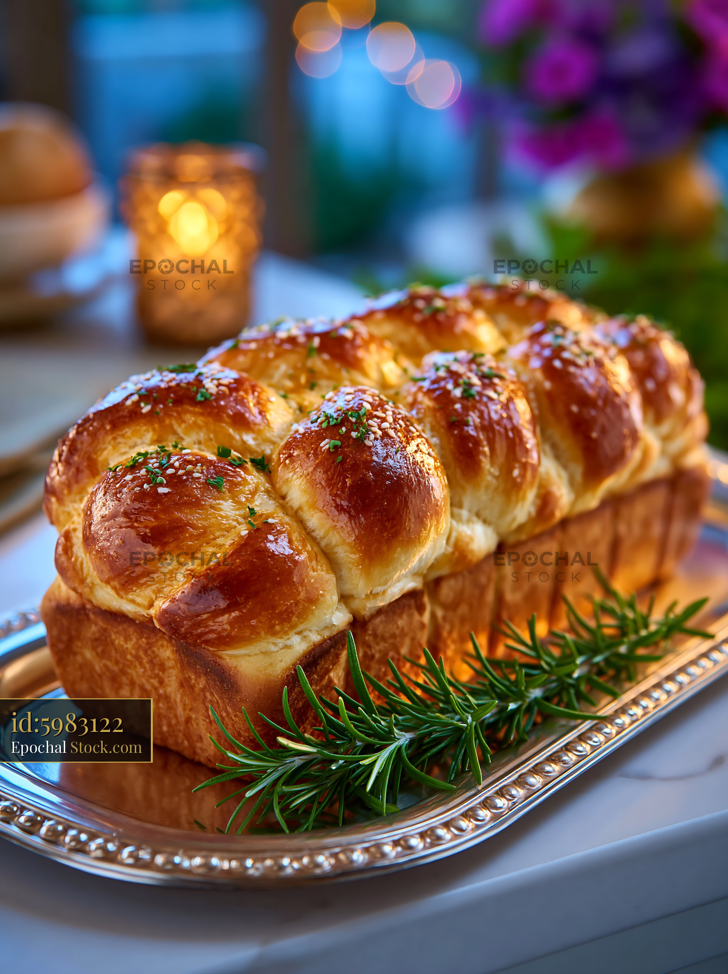 Golden brown dutch crunch german bread served on a silver platter - stock photo