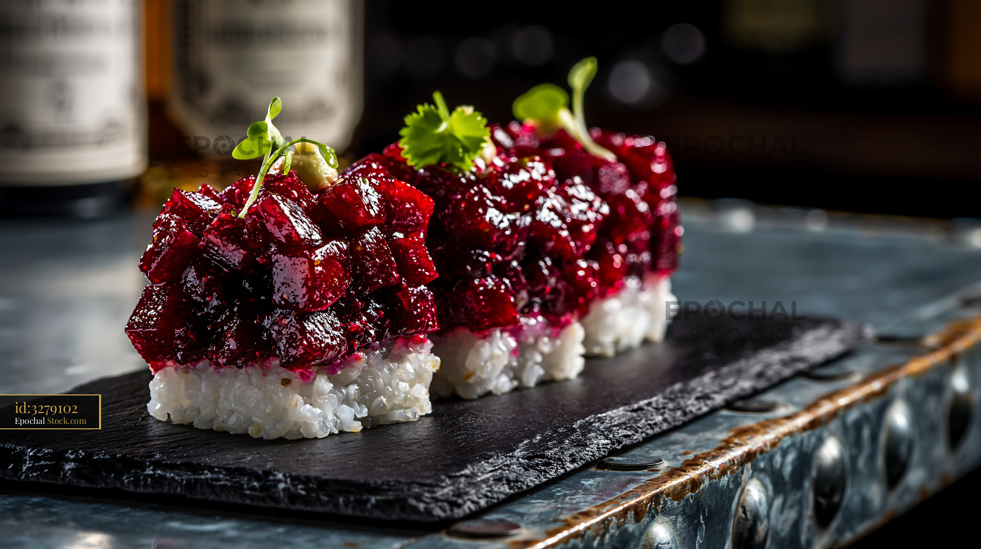 Vegan beet tartare sushi appetizers on a black slate board - stock photo