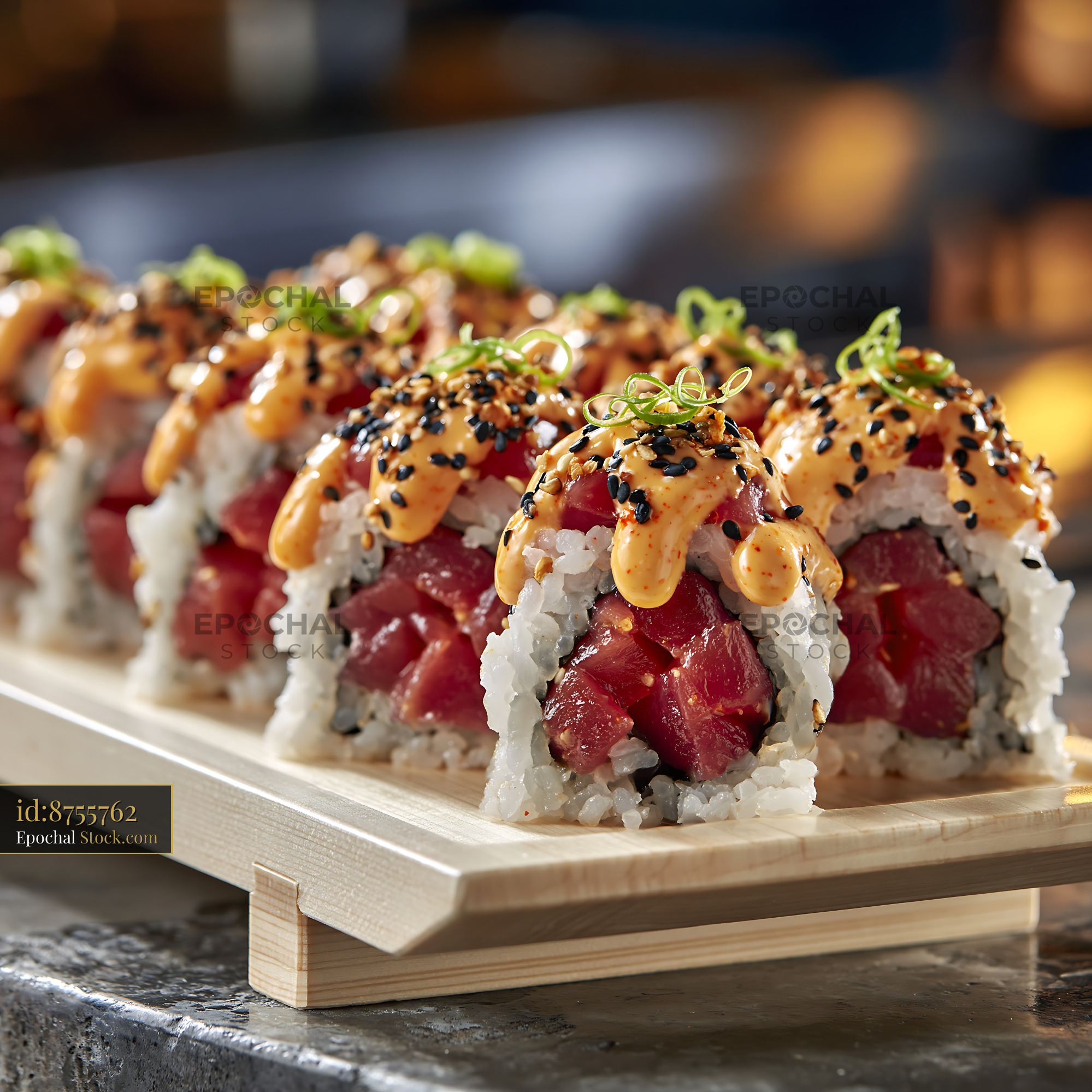 Fresh spicy tuna sushi rolls with sriracha mayo and sesame seeds - stock photo