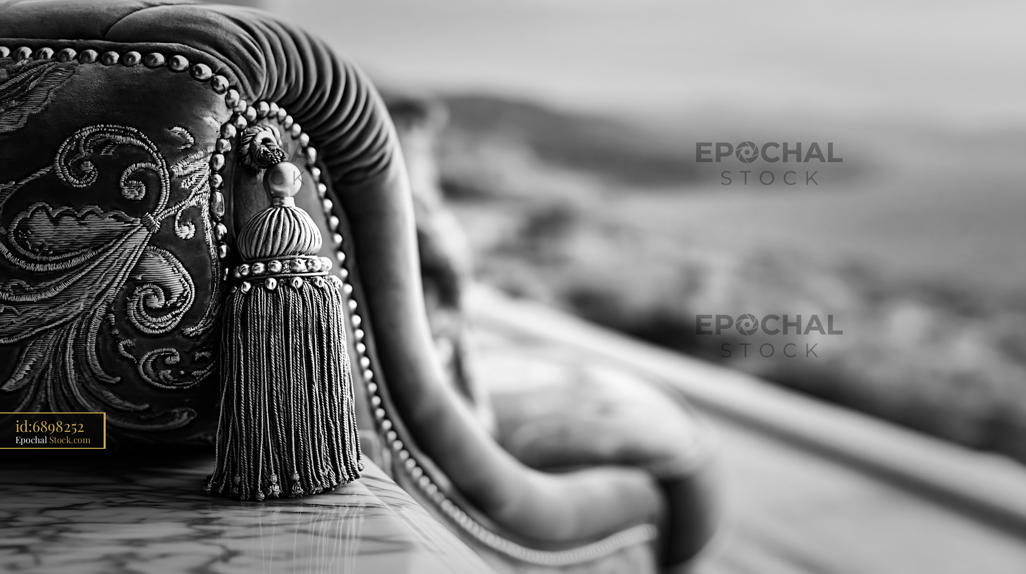 Close up of ornate furniture on a luxury hotel balcony with sea view - stock photo