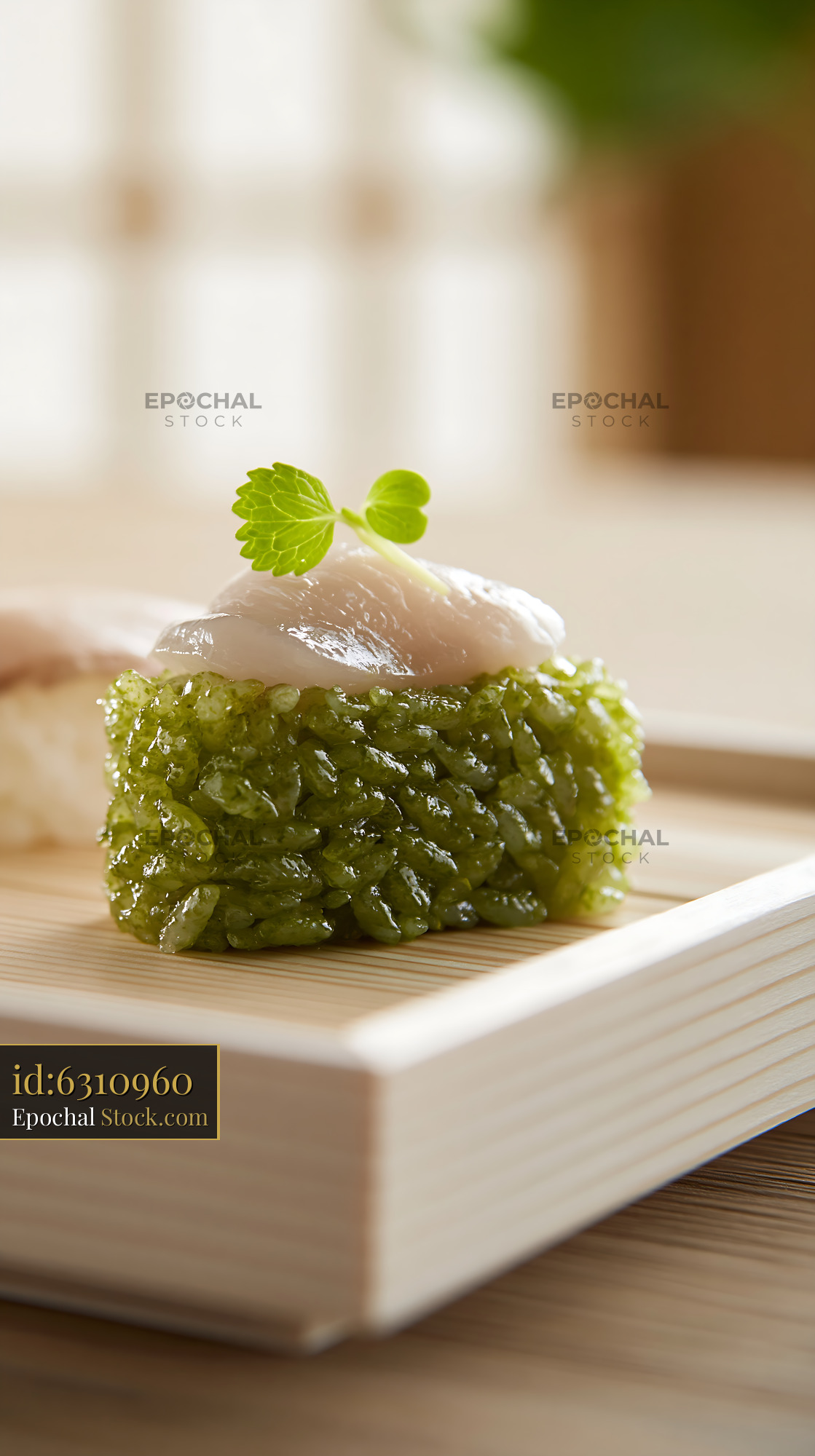 Gourmet nigiri sushi with matcha infused rice and raw white fish - stock photo