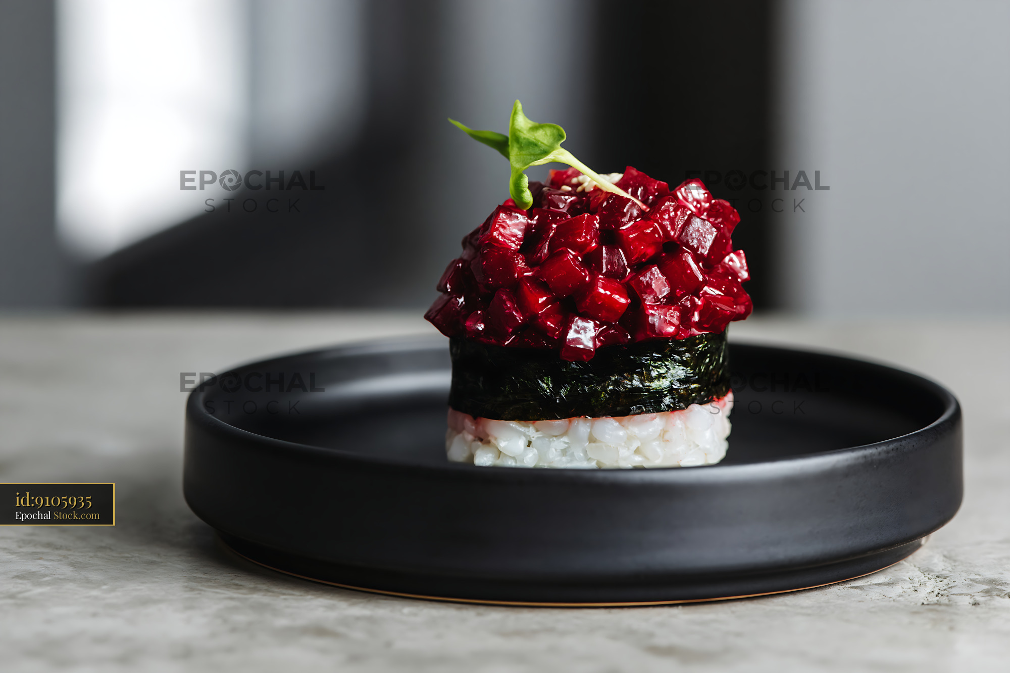 Vegan beet tartare sushi on a minimalist black ceramic plate - stock photo