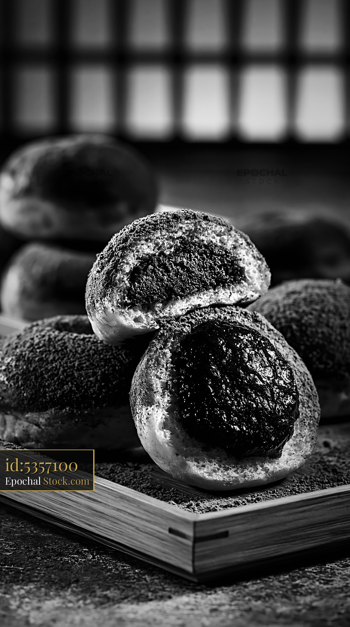 Close up of matcha anko filled donuts on a rustic wooden tray - stock photo