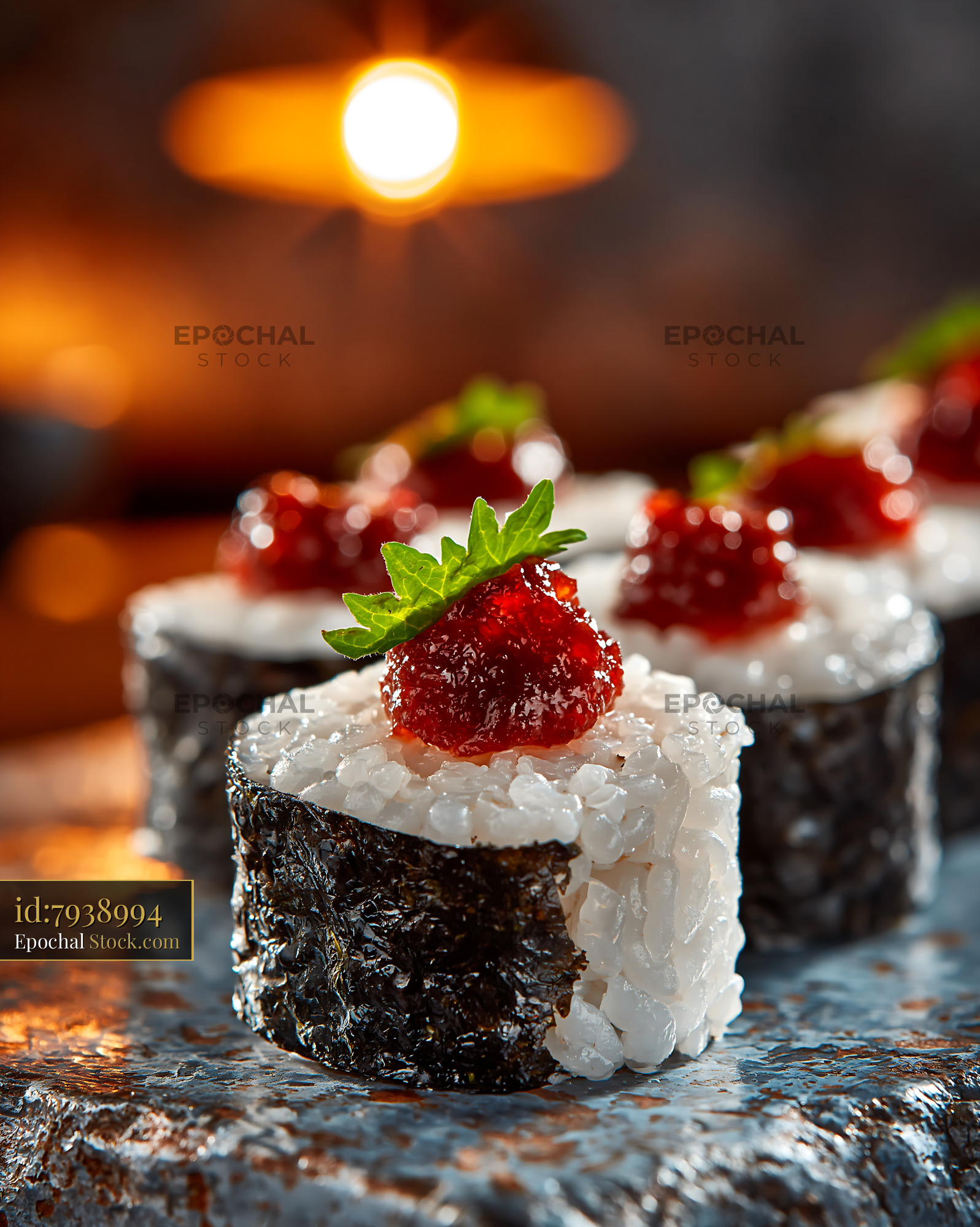 Salted plum umeboshi sushi rolls on a textured stone plate - stock photo