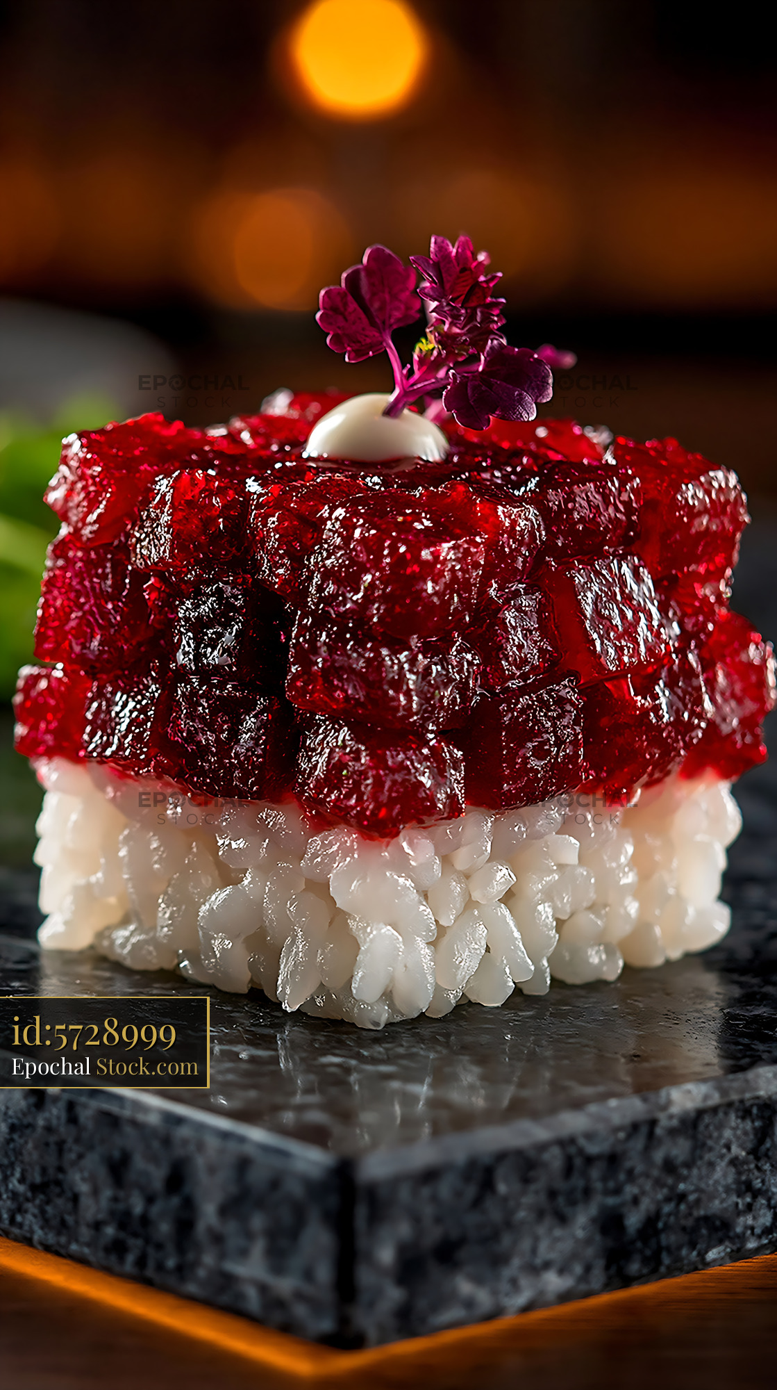 Beet tartare sushi with rice and microgreens on dark stone plate - stock photo