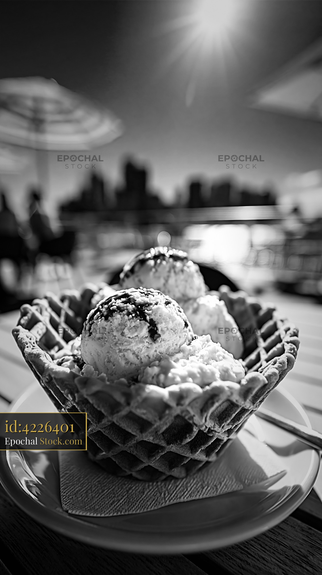 Gourmet balsamic ice cream in a waffle bowl on a sunny terrace - stock photo