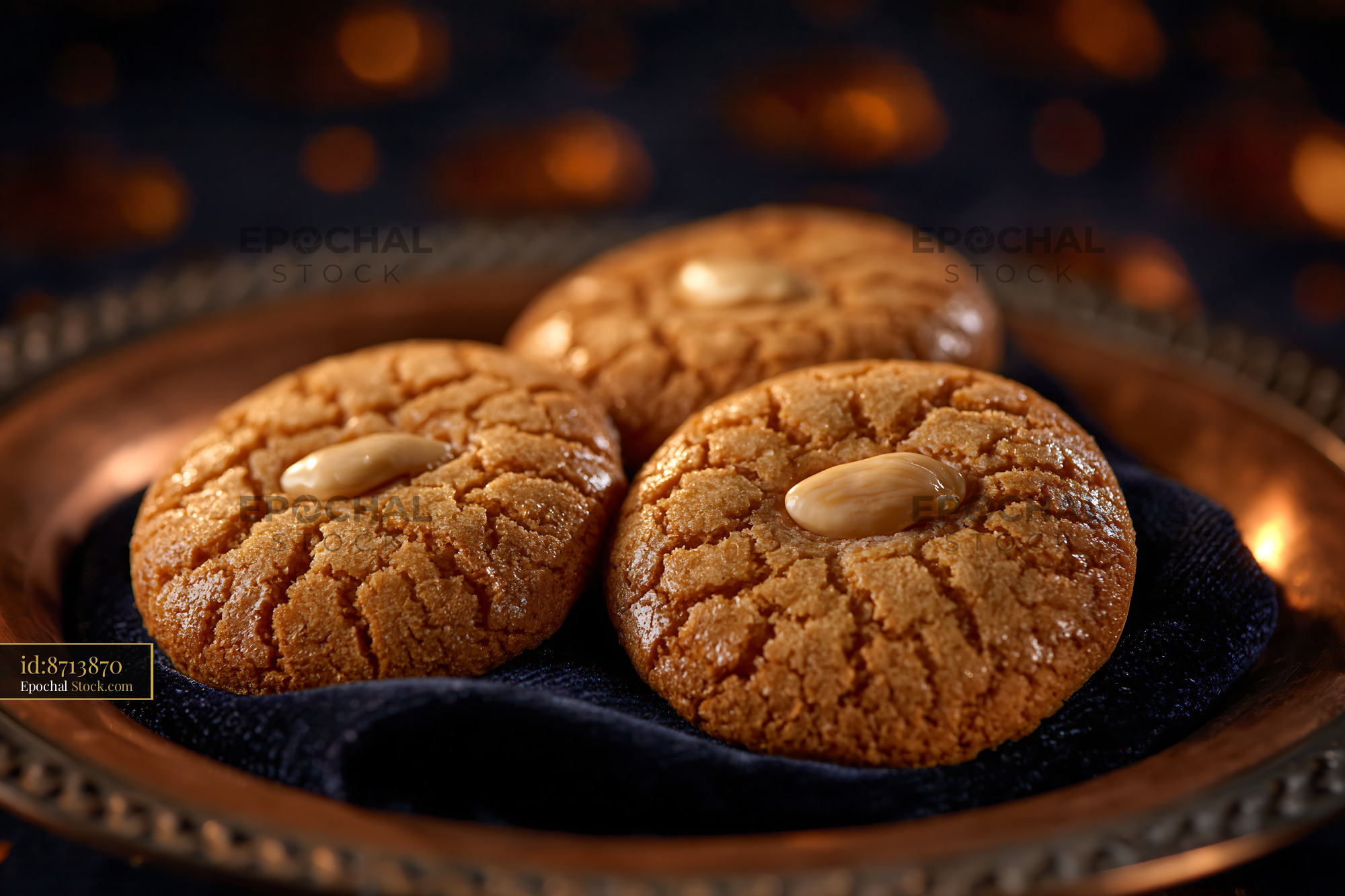 Turkish acibadem kurabiyesi biscuits with almonds on a copper plate - stock photo