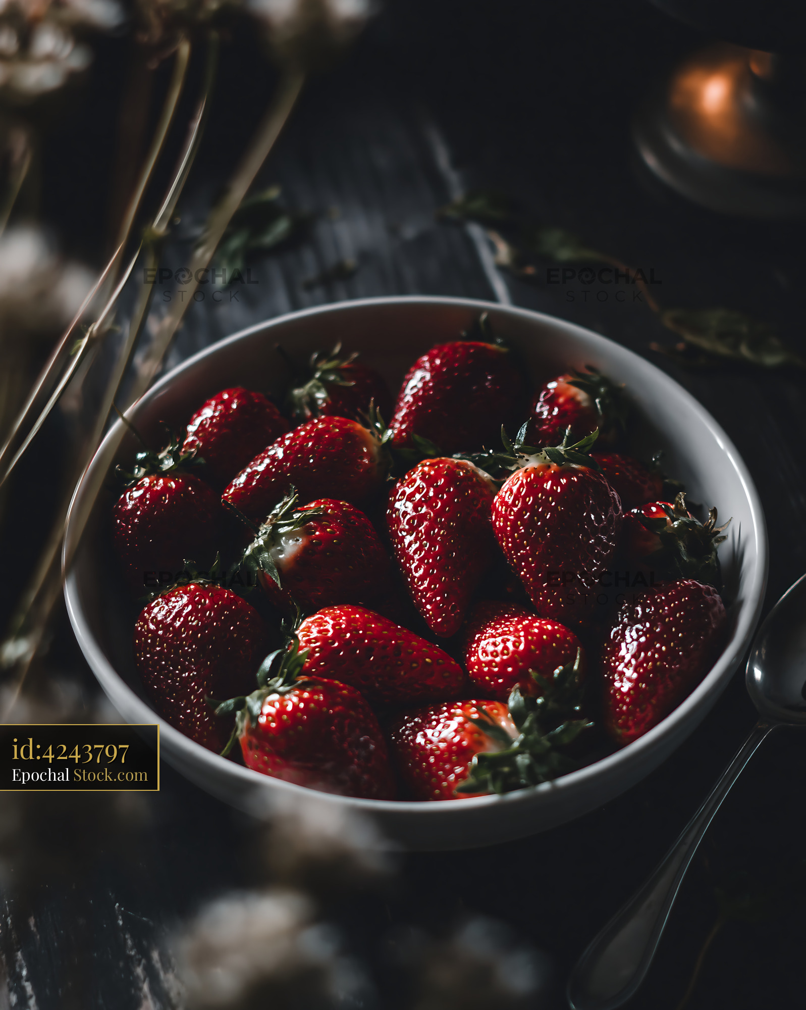 Fresh ripe strawberries in a bowl for a barbecue grill garden party - stock photo