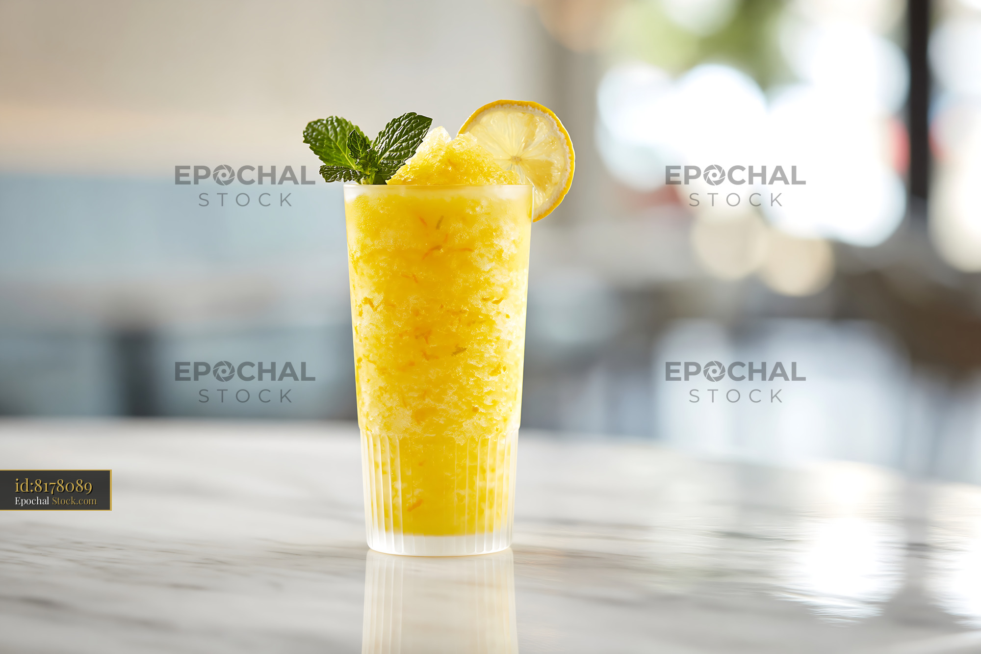 Cold yuja citron smoothie with lemon and mint on a marble counter - stock photo