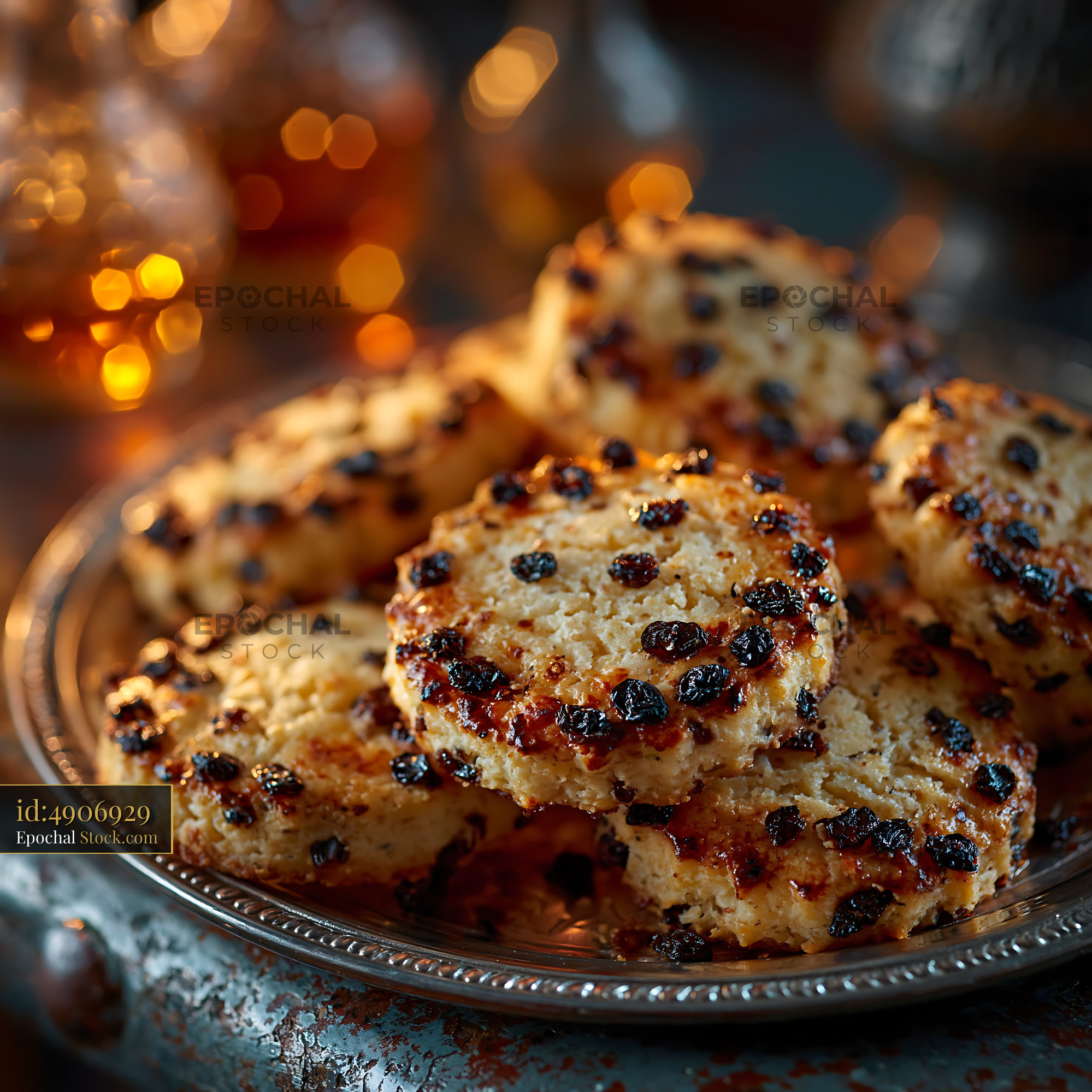 Golden shirini kishmishi raisin cookies on a vintage silver plate - stock photo