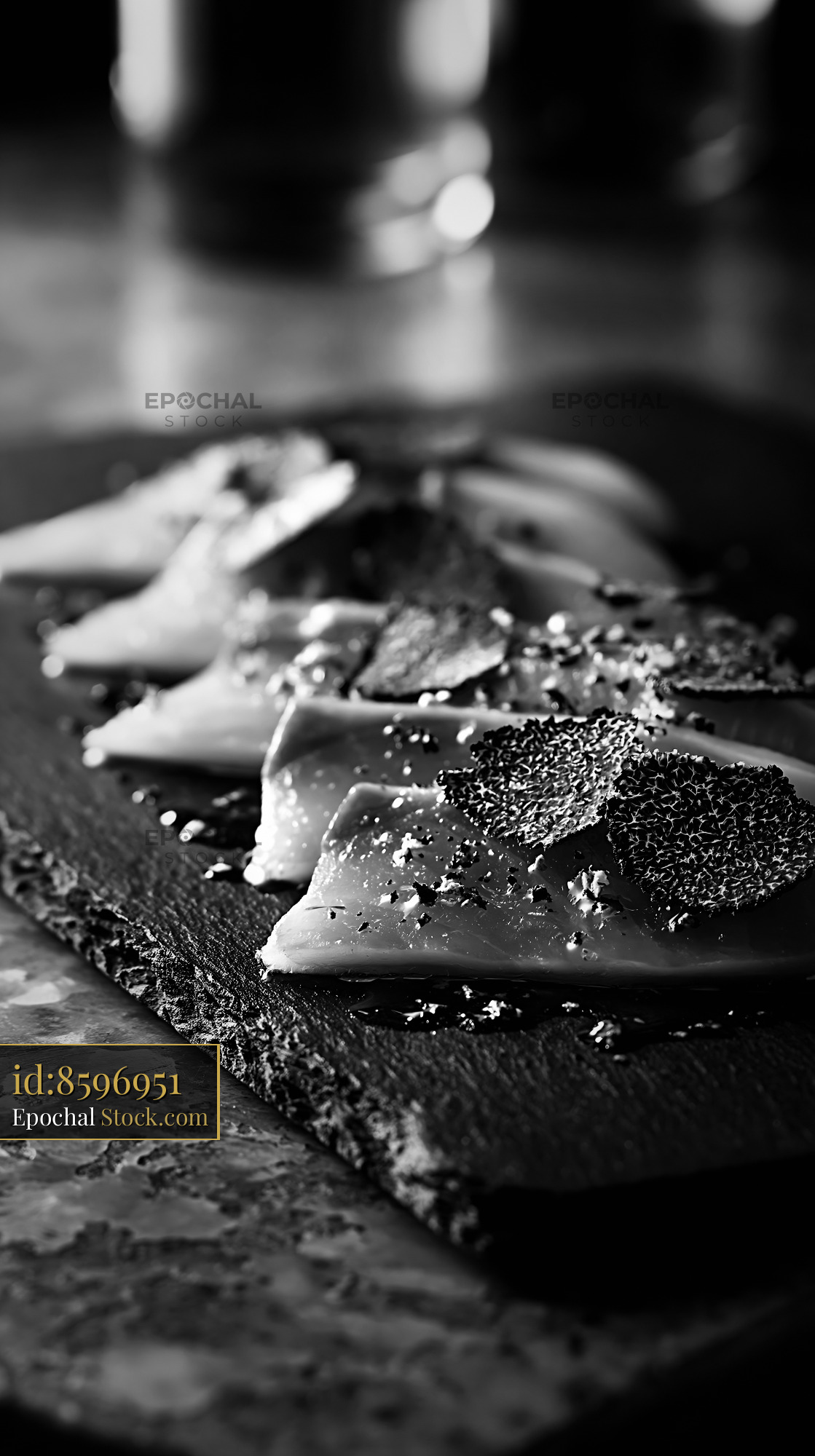 Truffle yellowtail sushi with fresh shavings on a dark slate board - stock photo