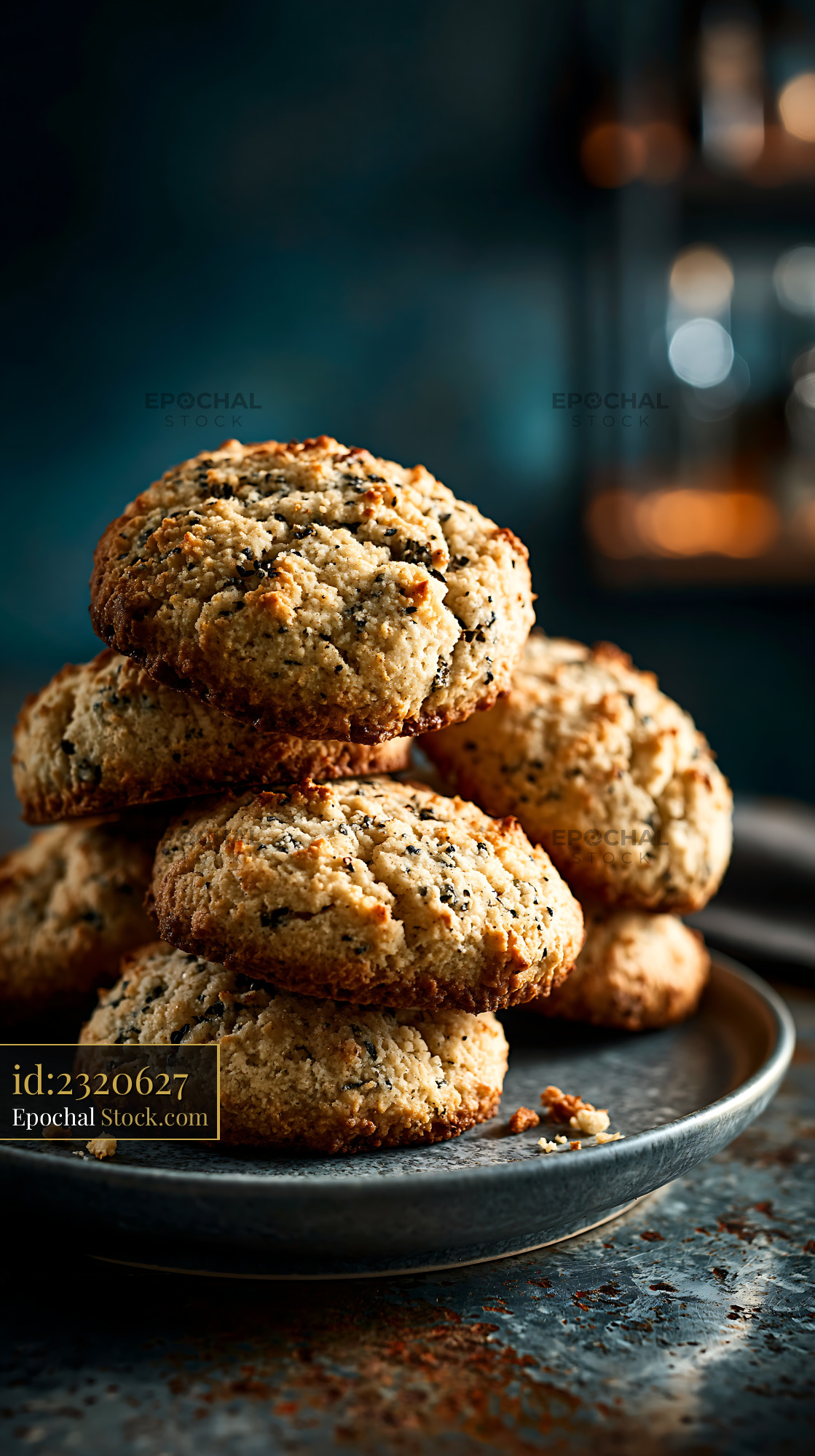 Cardamom chickpea biscuits stacked on a rustic plate - stock photo