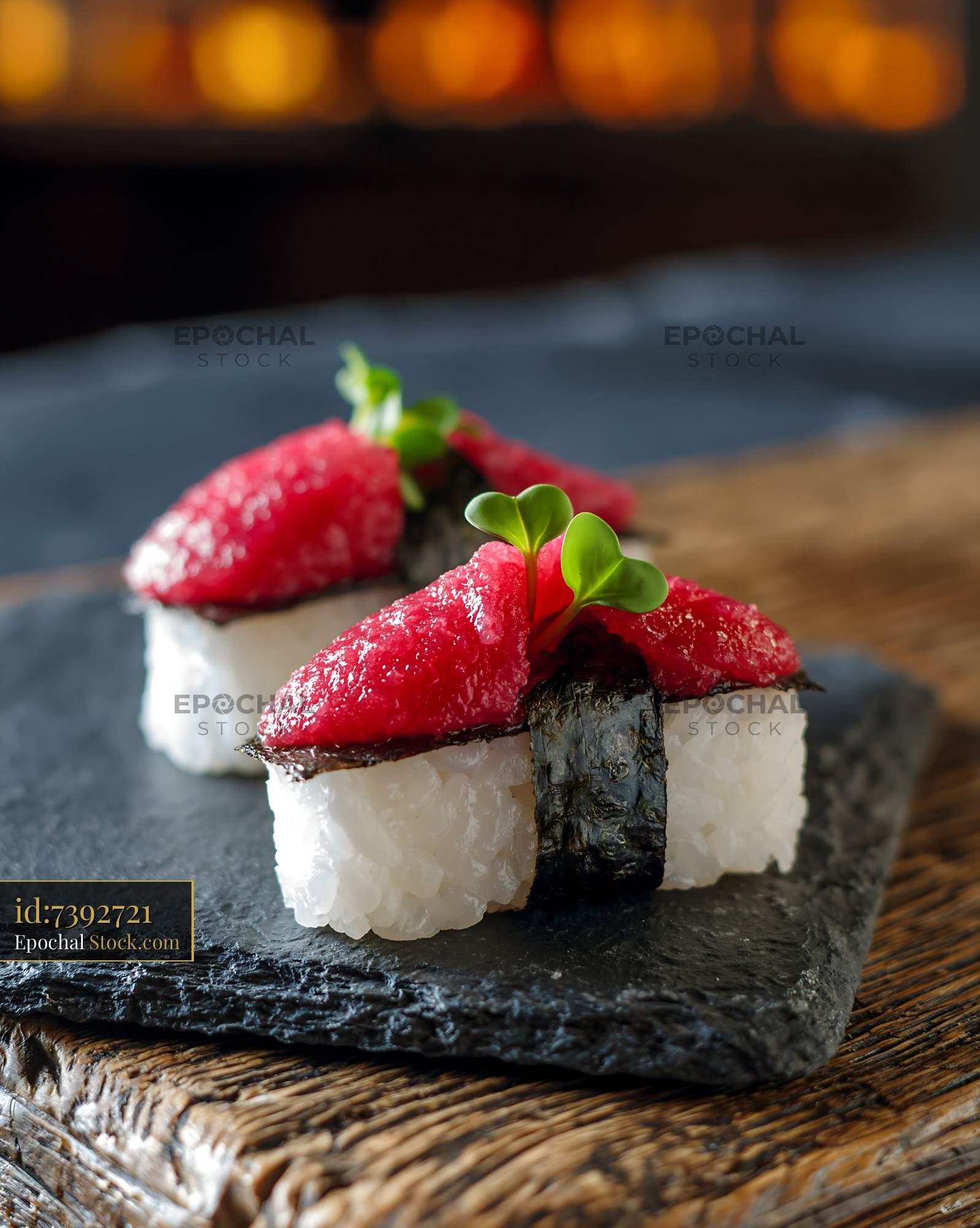 Salted plum umeboshi sushi served on a dark slate plate - stock photo