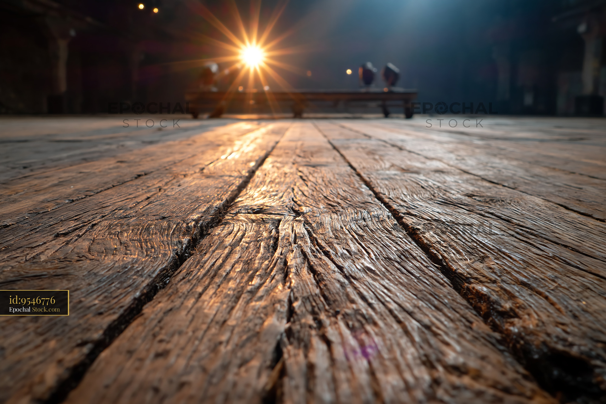 Worn wooden stage floor illuminated by bright spotlight in empty theat - stock photo