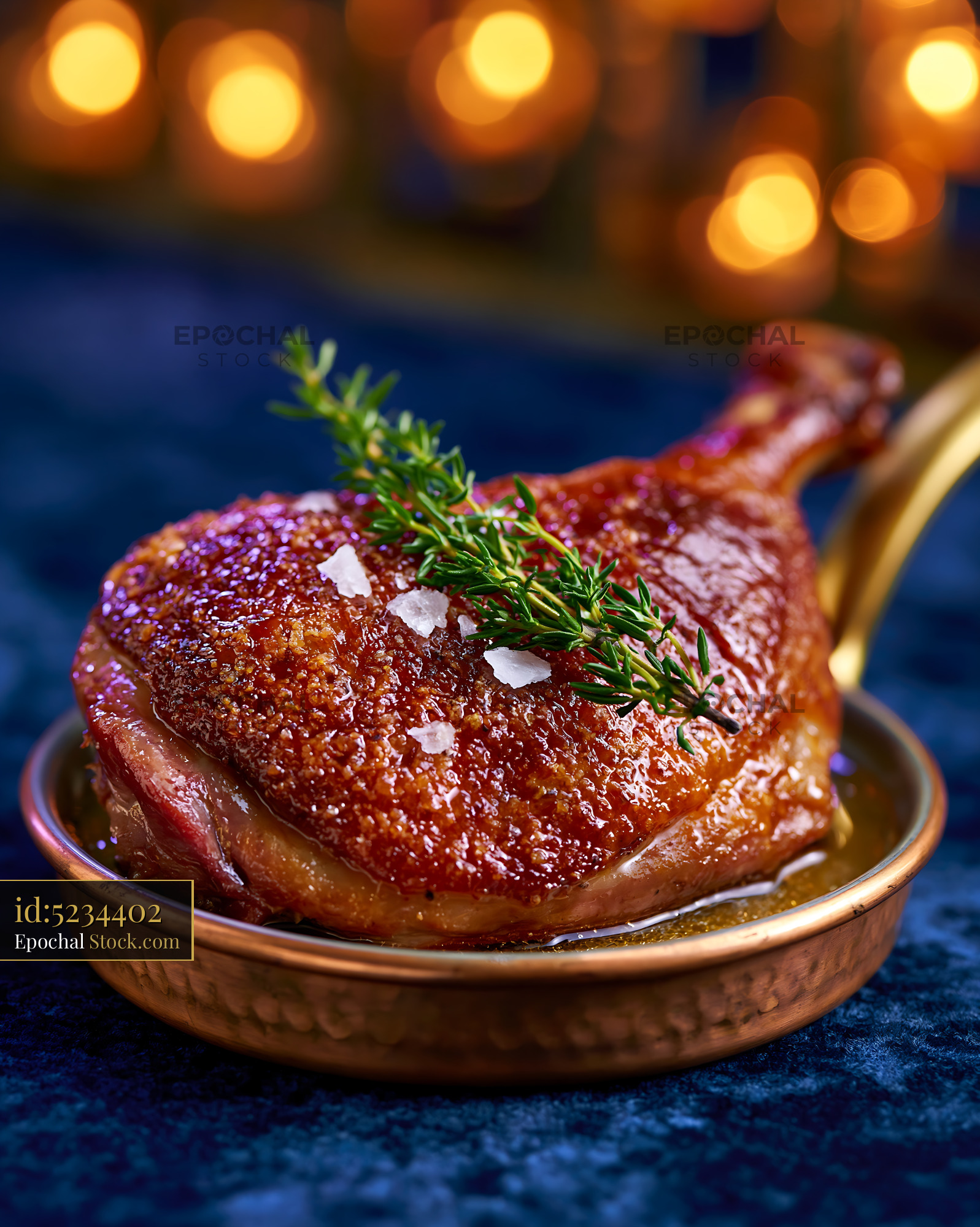 Roasted confit de canard meat with crispy skin and thyme in copper pan - stock photo
