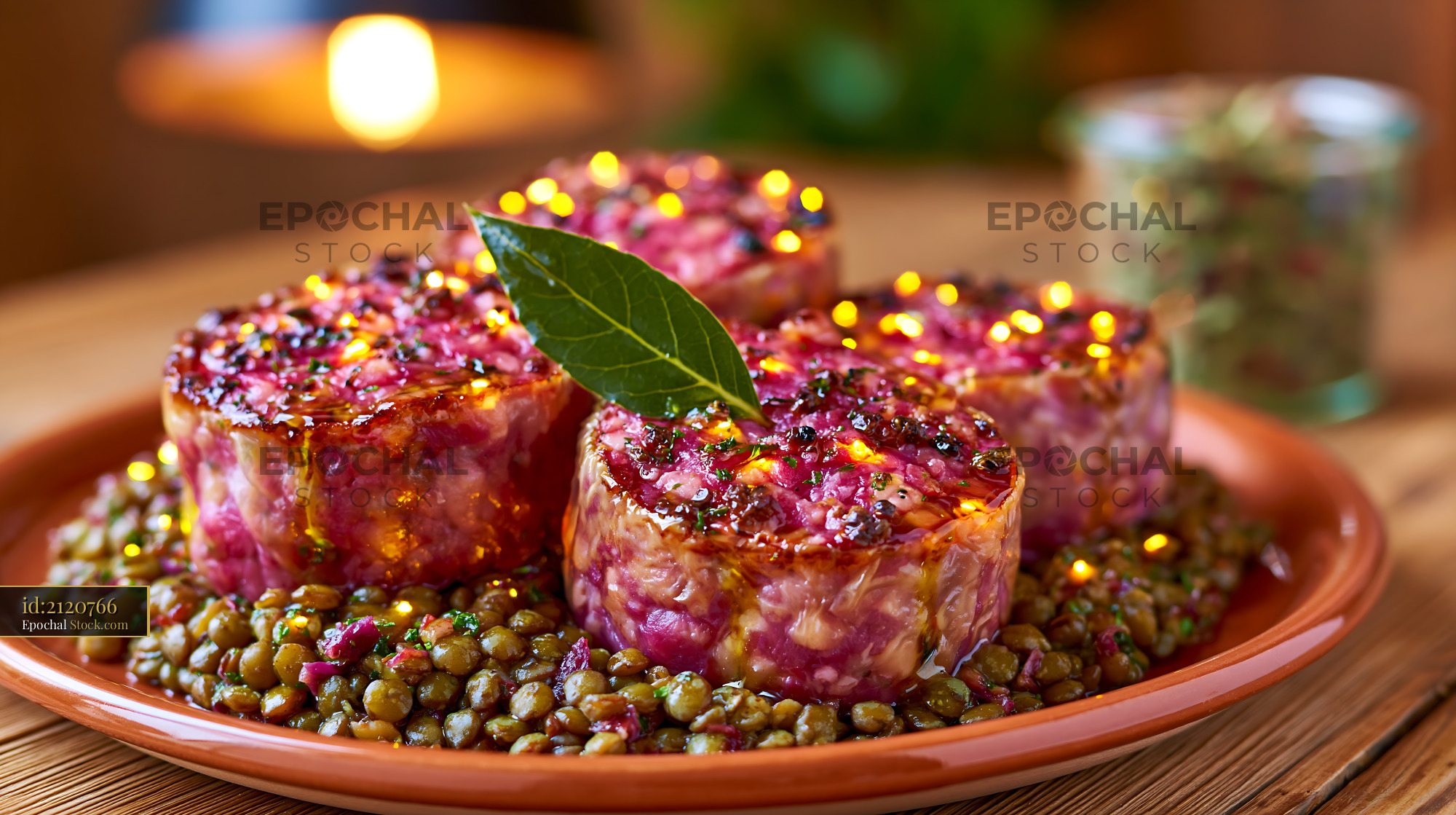 Soppressata di calabria meat served with lentils on a rustic plate - stock photo