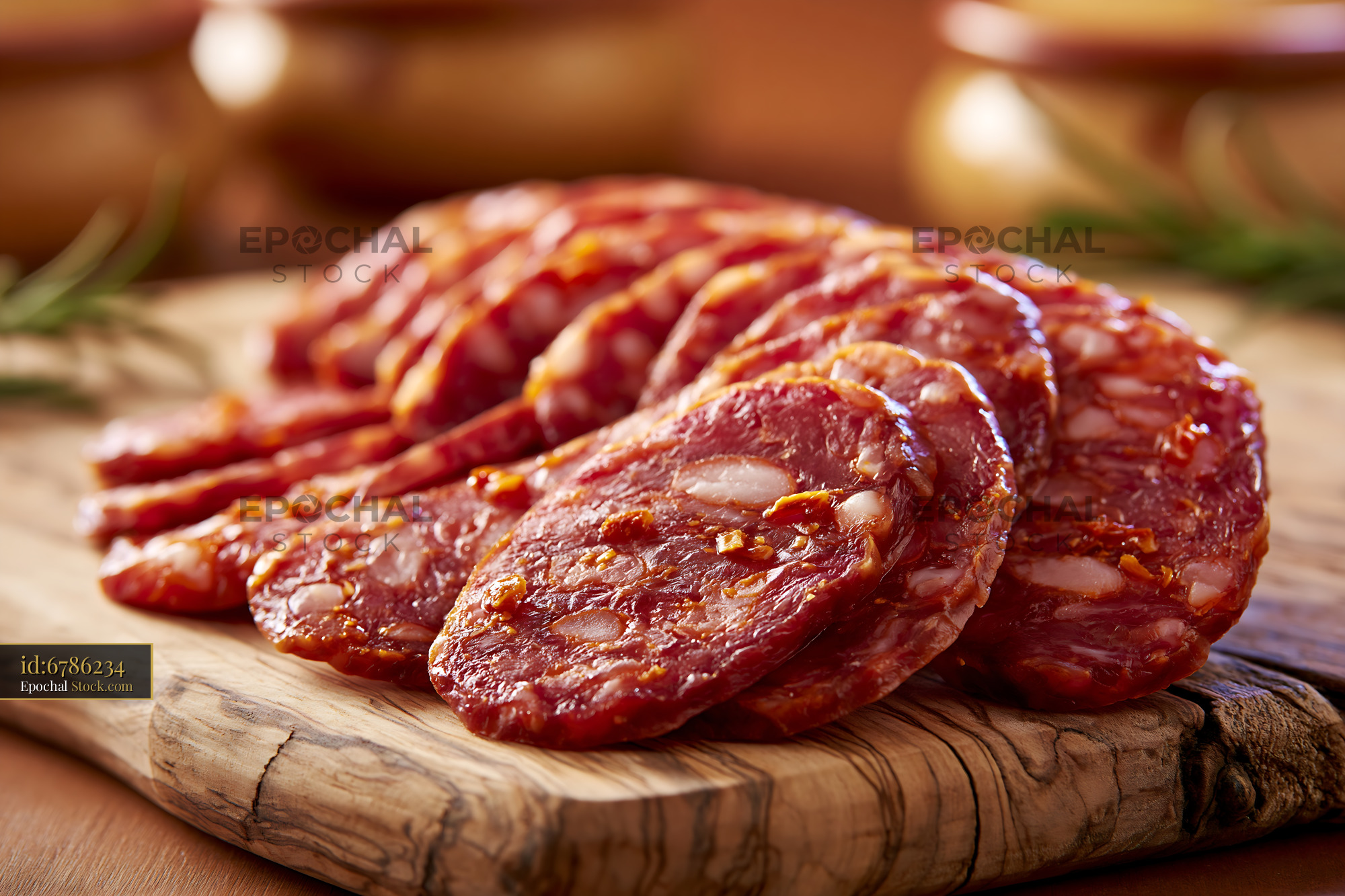 Traditional soppressata di calabria meat slices on a rustic wooden boa - stock photo