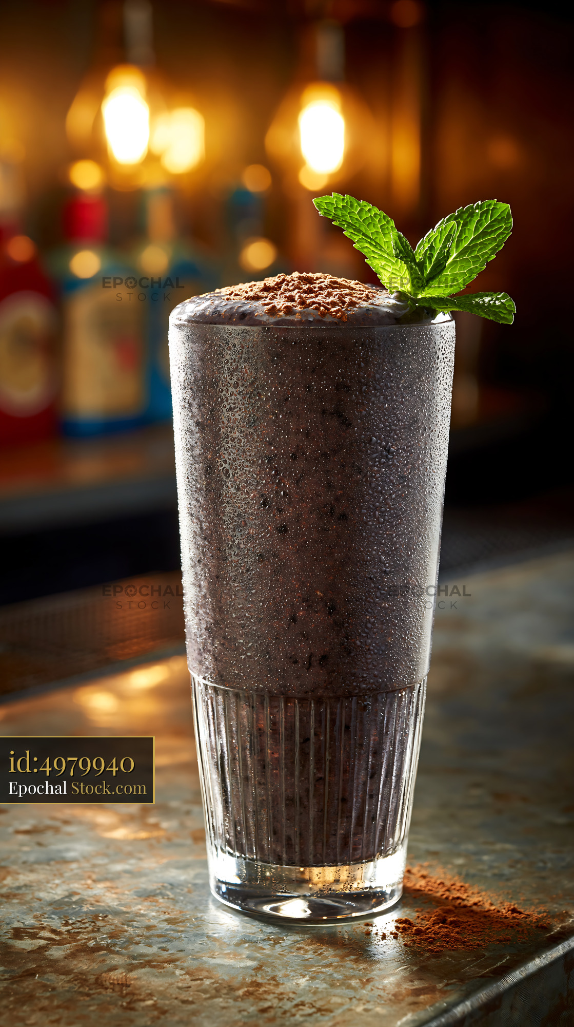 Chilled black bean smoothie with cocoa and mint on a rustic bar - stock photo