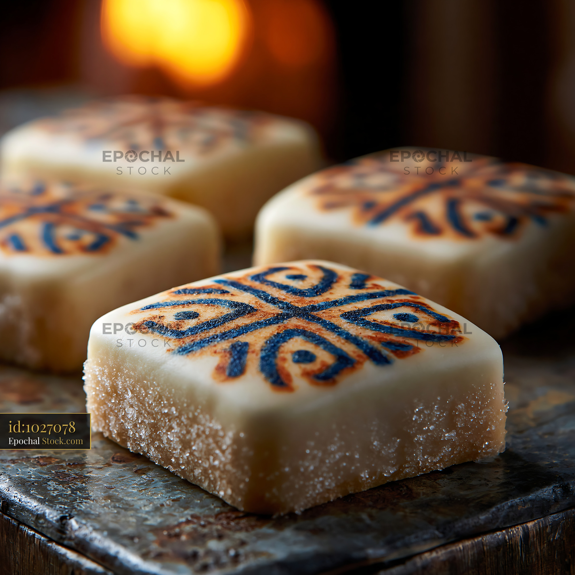Traditional square marzipan sweets with decorative patterns - stock photo
