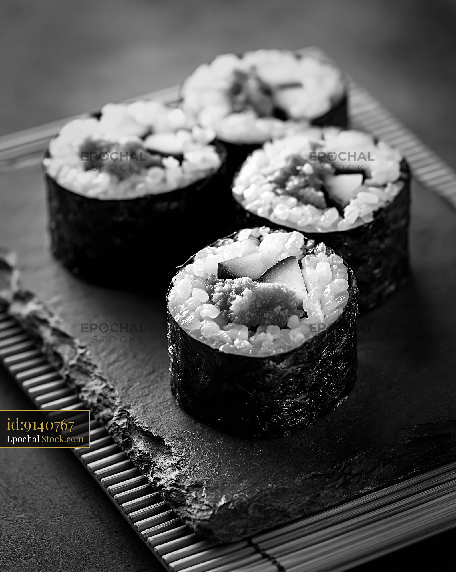 Salted plum umeboshi sushi maki served on a slate platter - stock photo