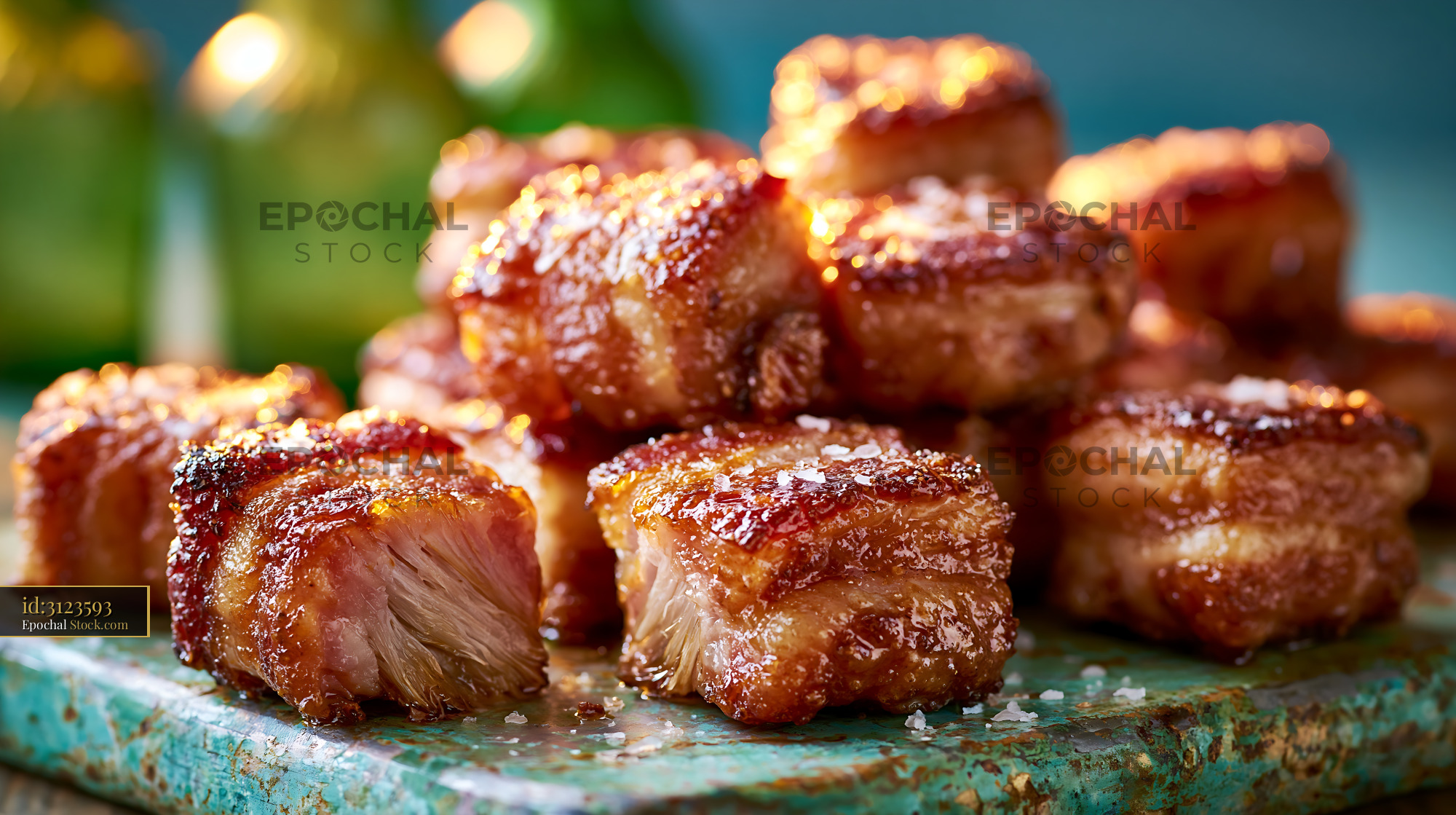 Crispy lardo di colonnata meat bites with sea salt on rustic tray - stock photo