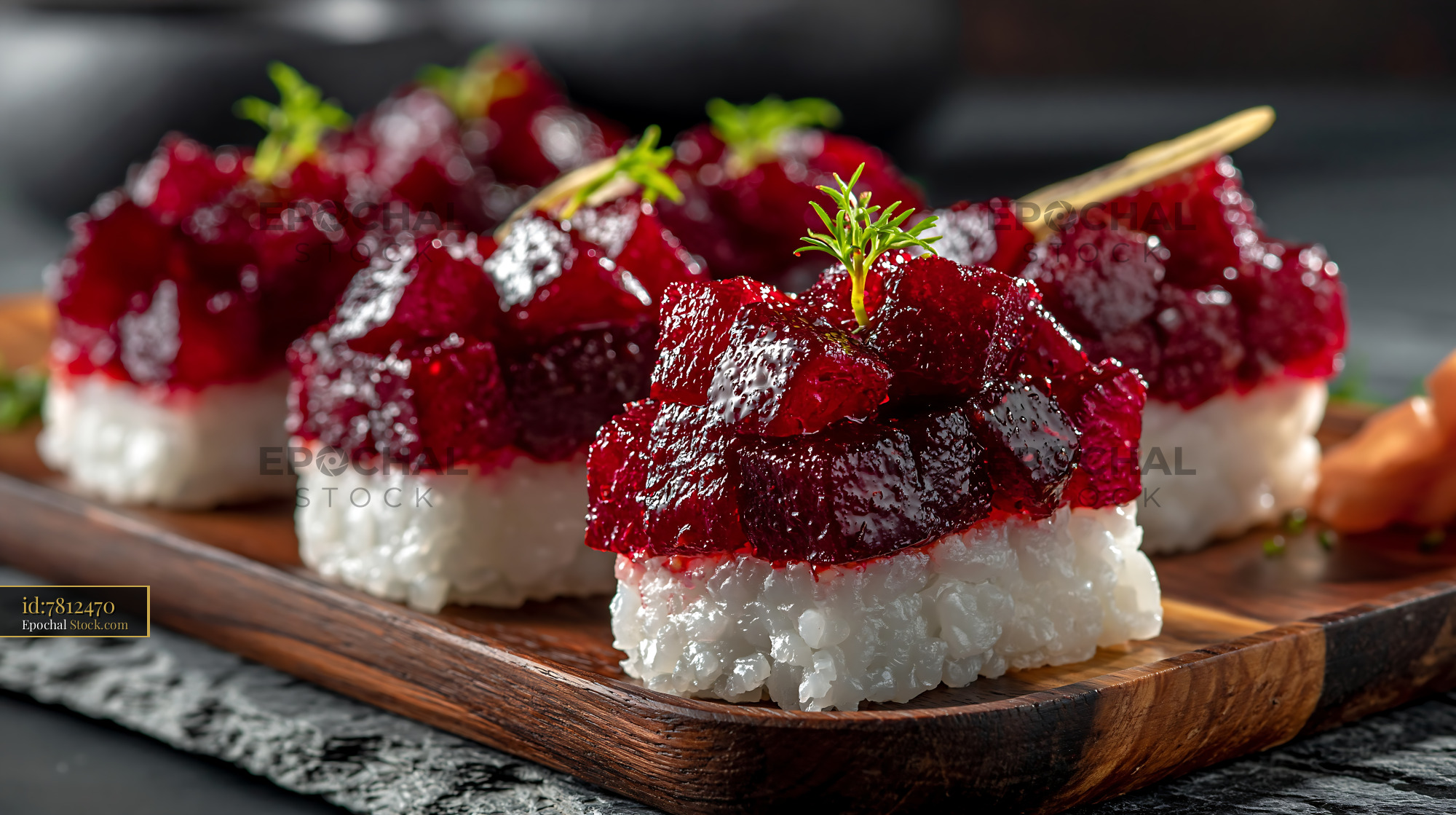 Vegan beet tartare sushi with fresh herbs on a wooden serving board - stock photo