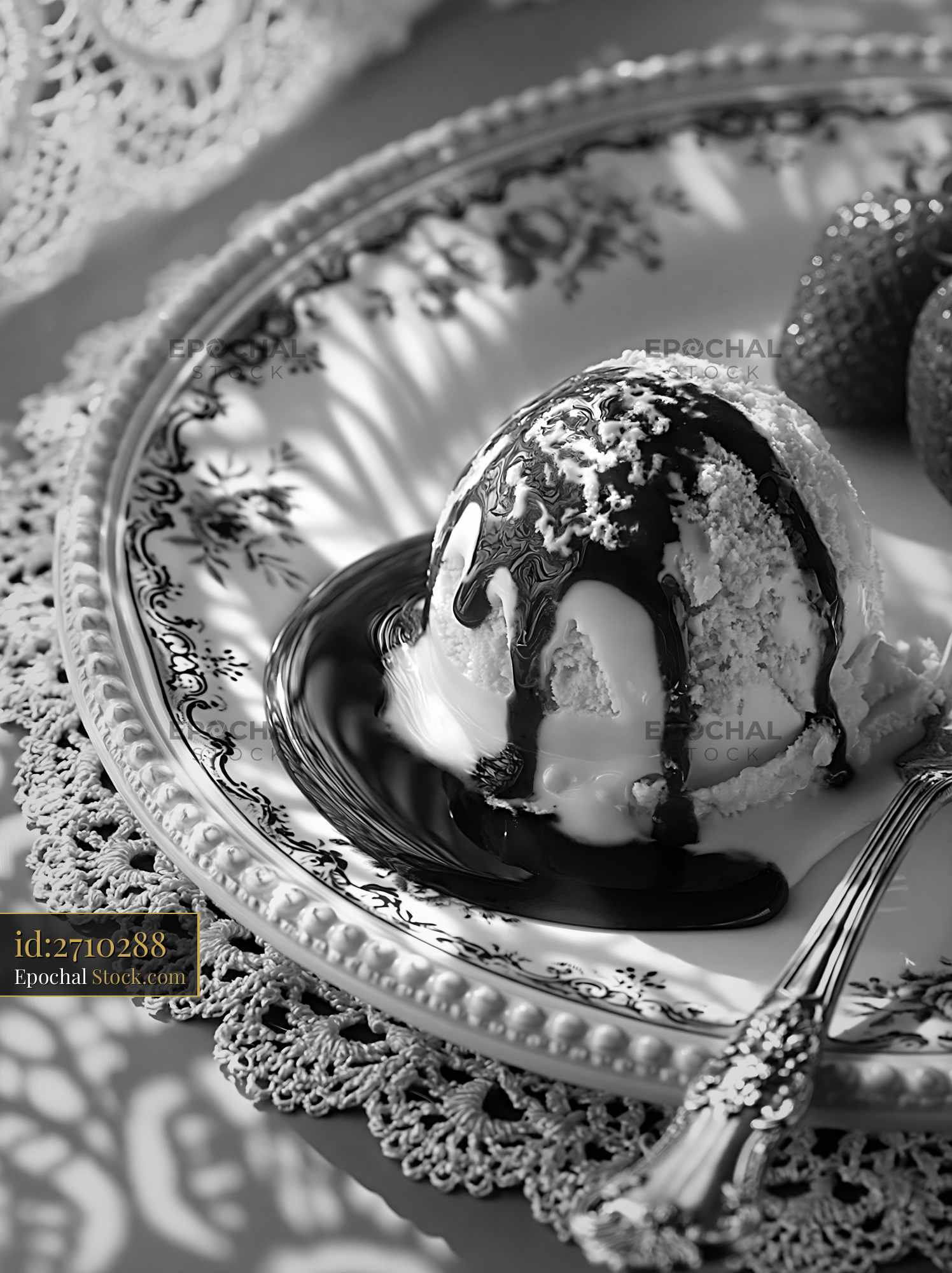 Scoop of prosecco ice cream with chocolate sauce on a vintage plate - stock photo