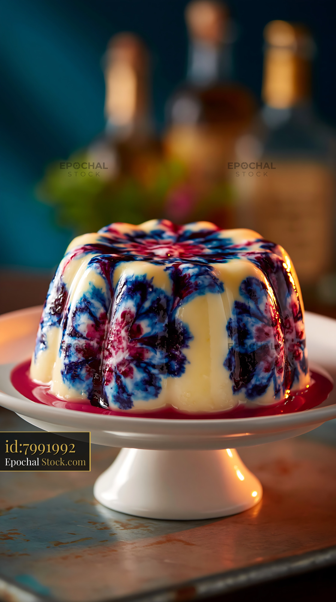 Gourmet panna cotta with blue floral marble pattern on a cake stand - stock photo
