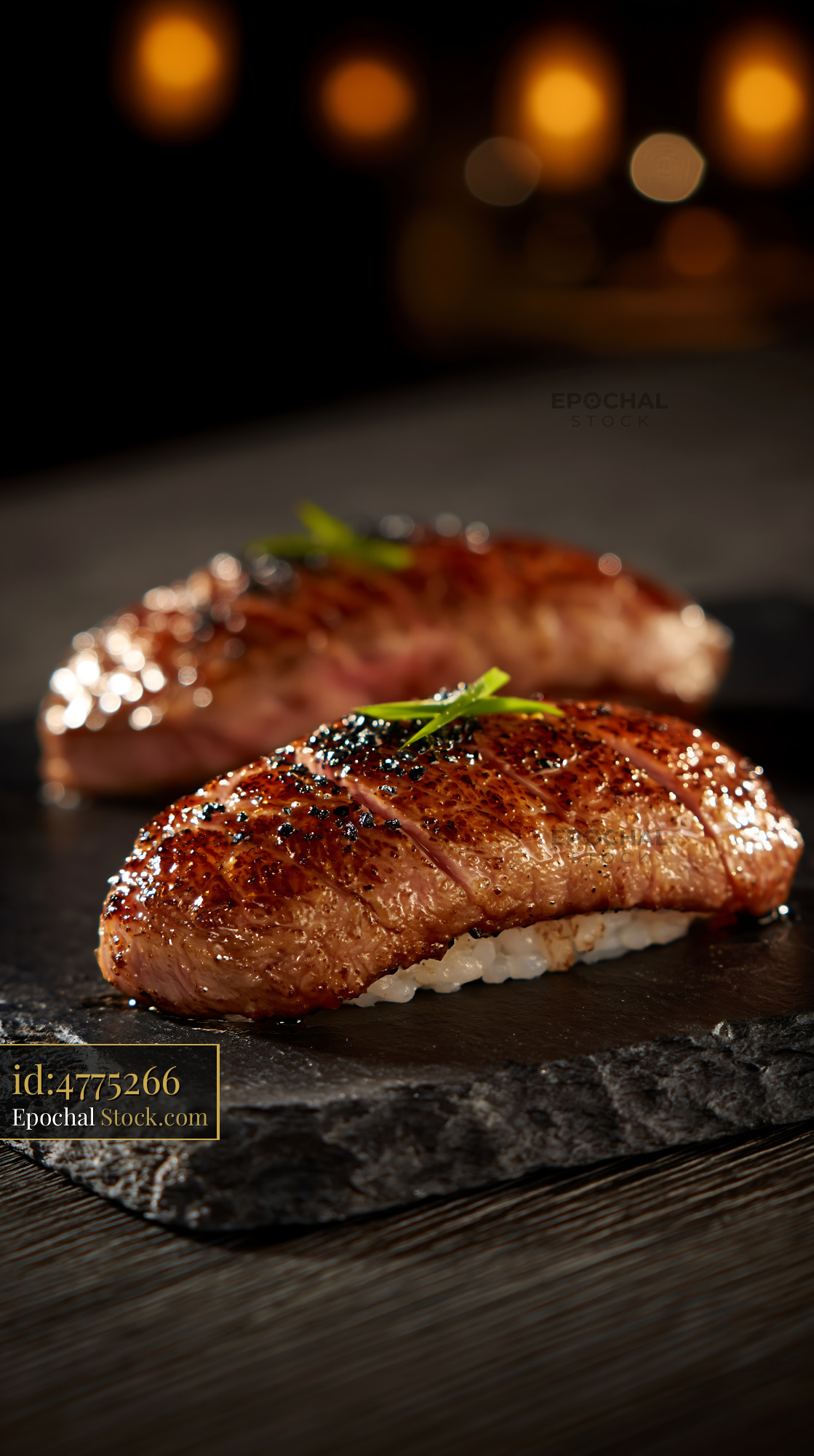 Aburi wagyu sushi with seared premium beef on a slate plate - stock photo