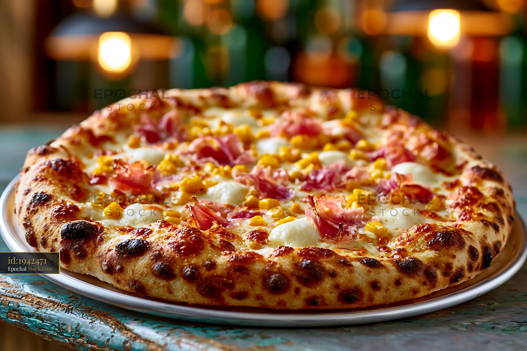Neapolitan panna mais pizza with prosciutto and corn on a rustic table - stock photo