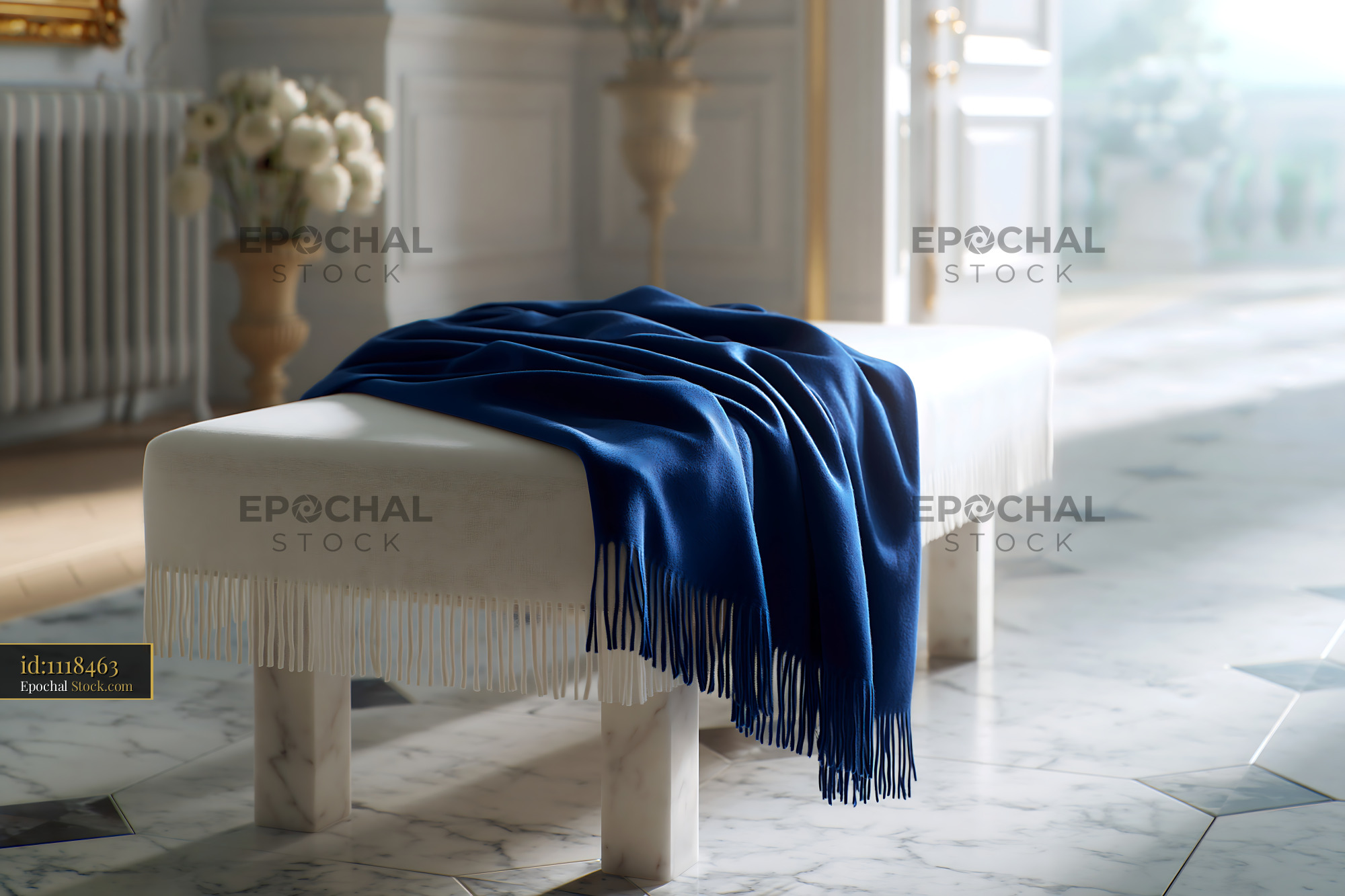 Blue cashmere throw on white marble bench in elegant interior - stock photo