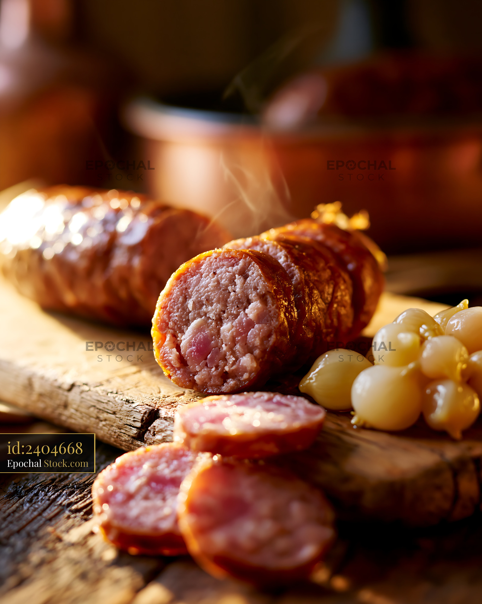 Saucisse de Montbeliard meat sliced on a rustic wooden board - stock photo