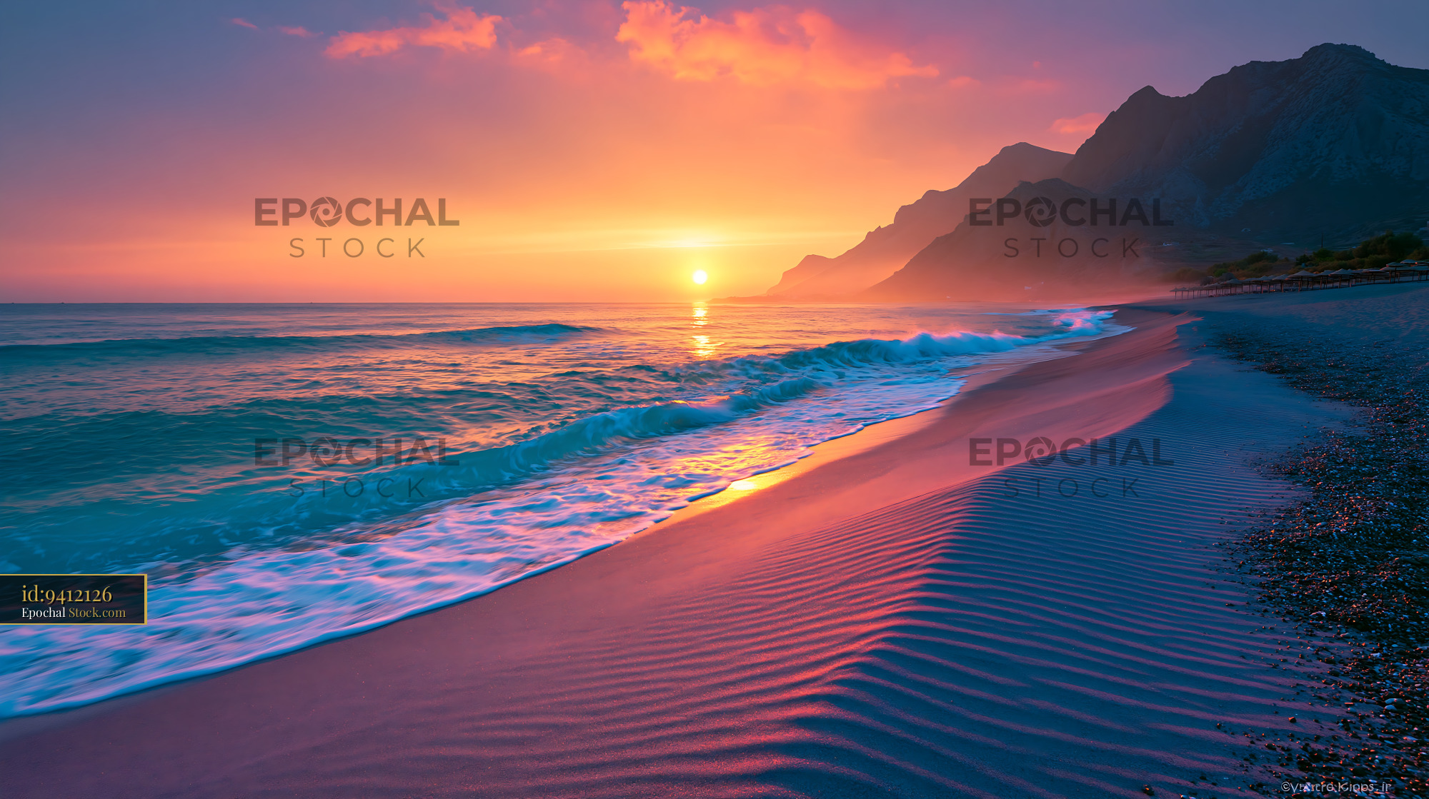 Vibrant sunset over a tropical beach with mountains and sand ripples - stock photo