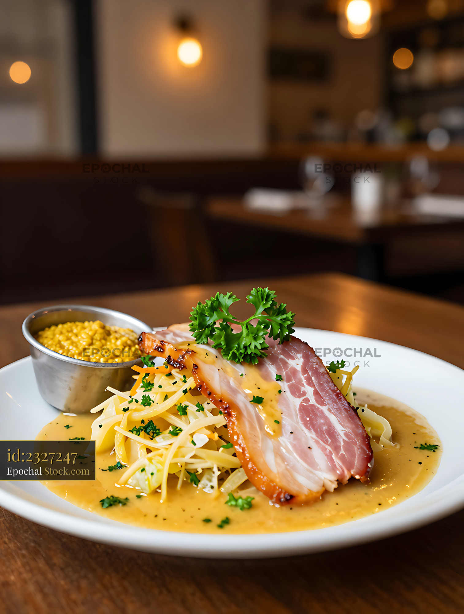 Traditional Irish bacon and cabbage with parsley sauce on a plate - stock photo